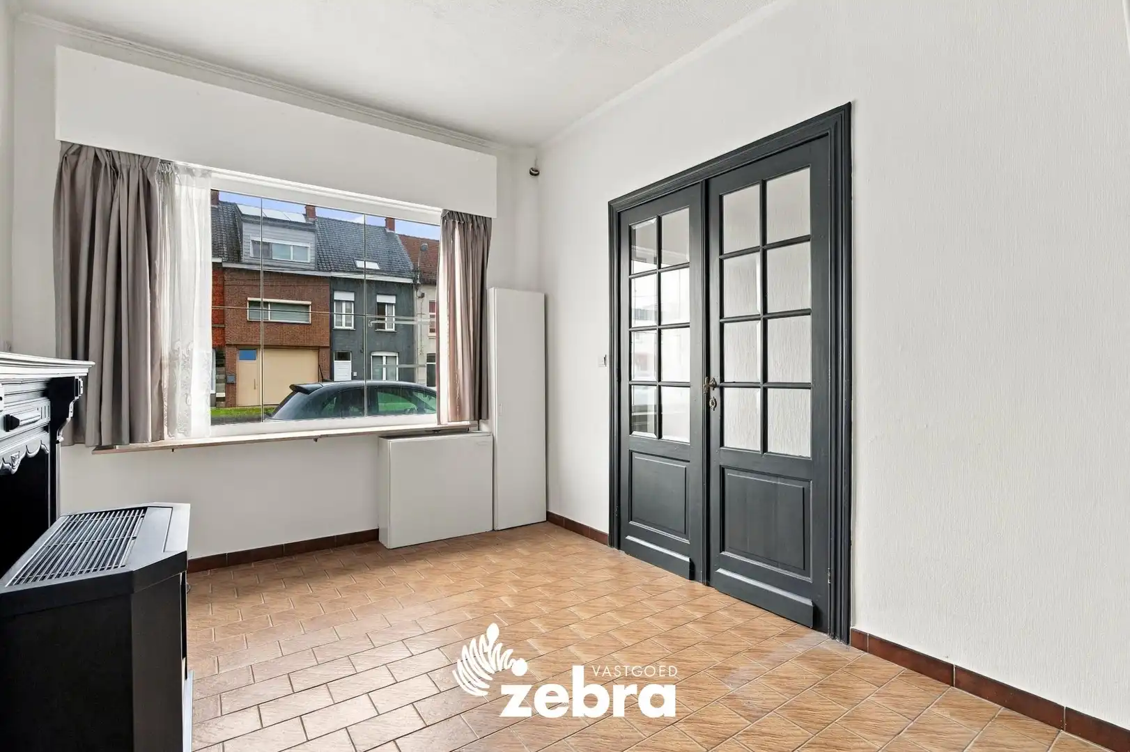 Te renoveren woning met uitweg te Roeselare! foto 3