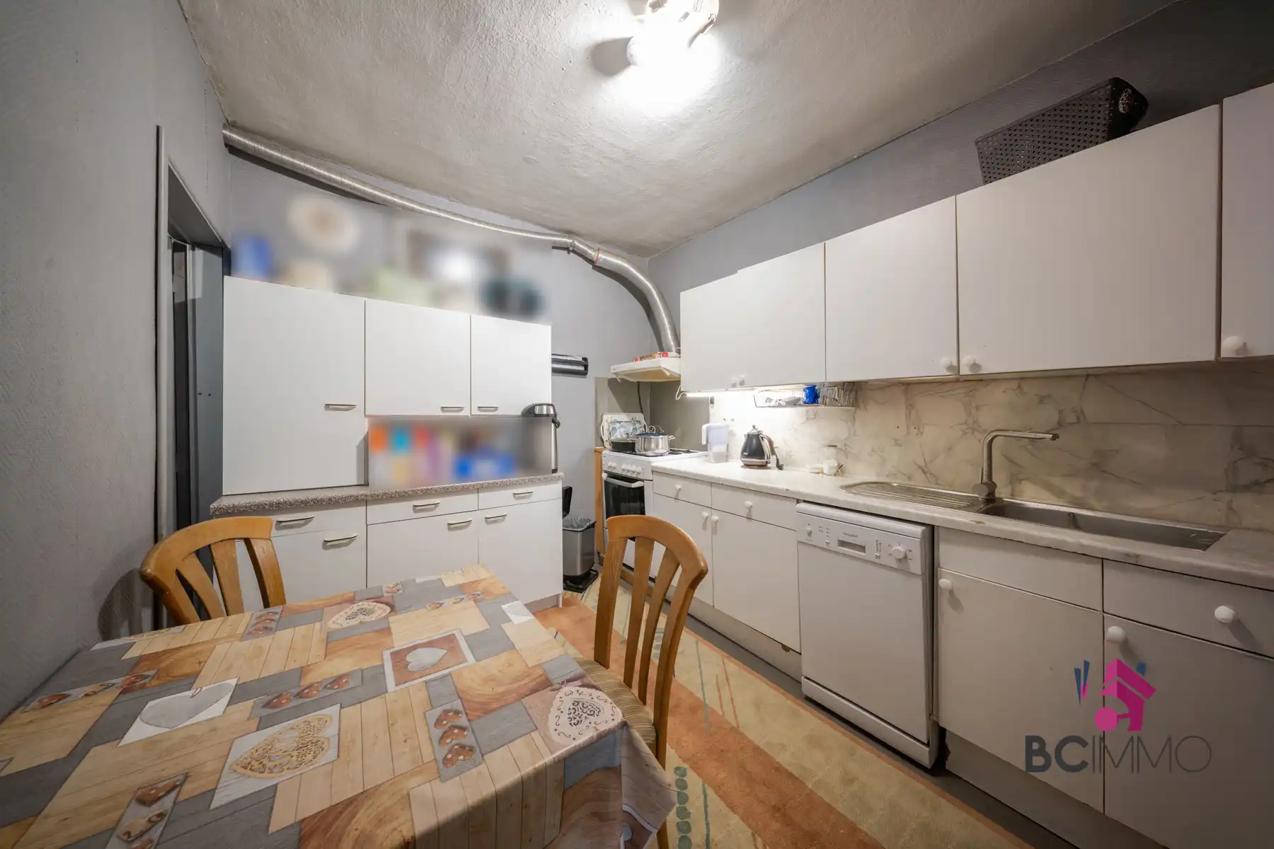 Halfopen bebouwing met twee woongedeeltes (125 m² + 95 m²) en tuin. foto 3