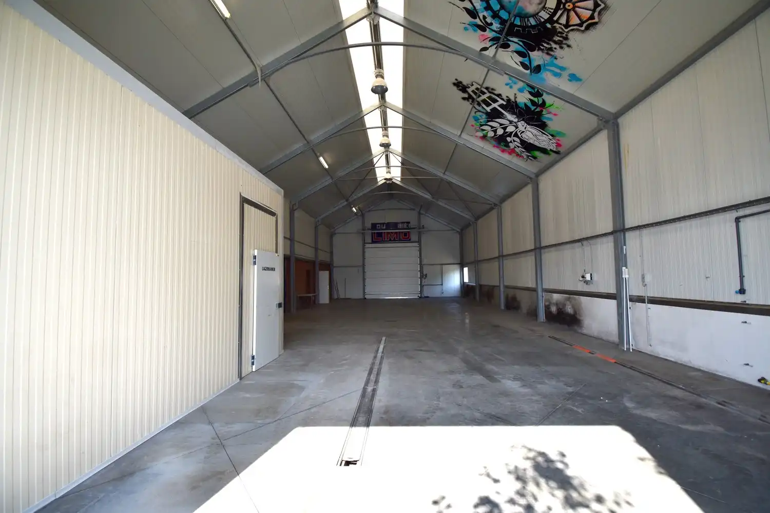 Polyvalent gebouw bestaande uit winkelruimte, appartement en loods foto 18