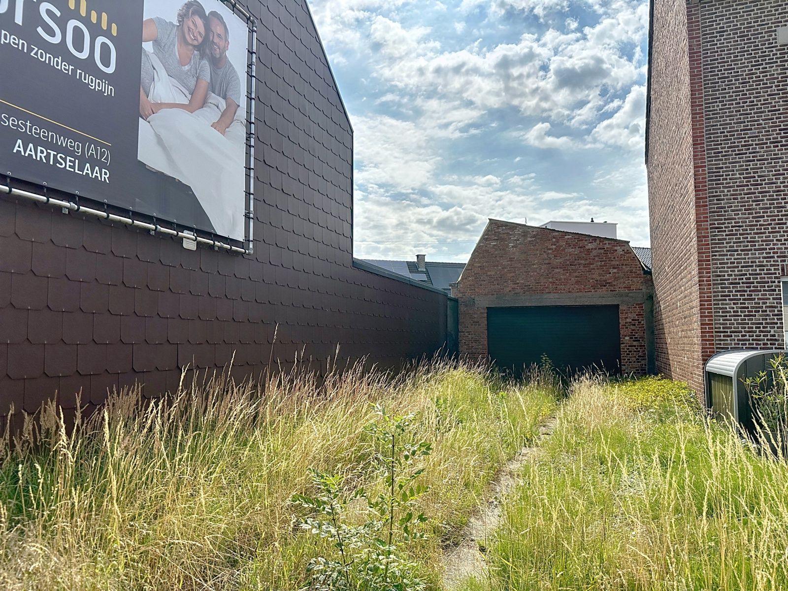 Bouwgrond met af te breken magazijn in centrum Schelle – mogelijk 6% btw op nieuwbouw! foto {{pictureIndex}}