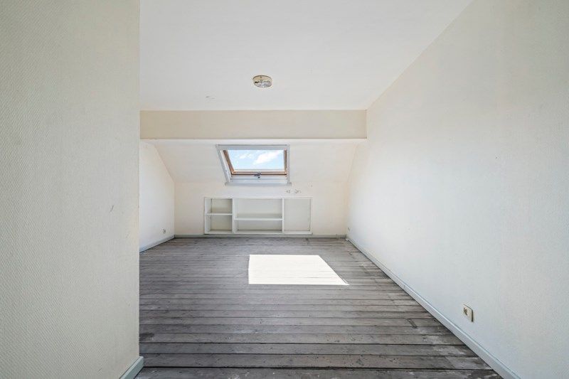 Te renoveren stadswoning met uitweg achteraan! foto 14