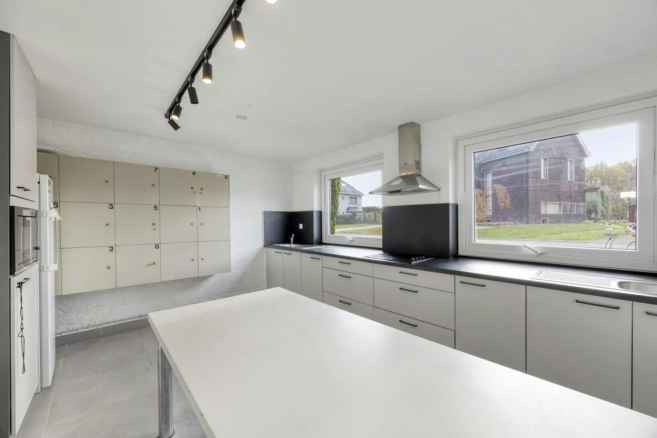 Opbrengsteigendom met 9 studentenkamers en duplex-appartement te Hasselt foto 4