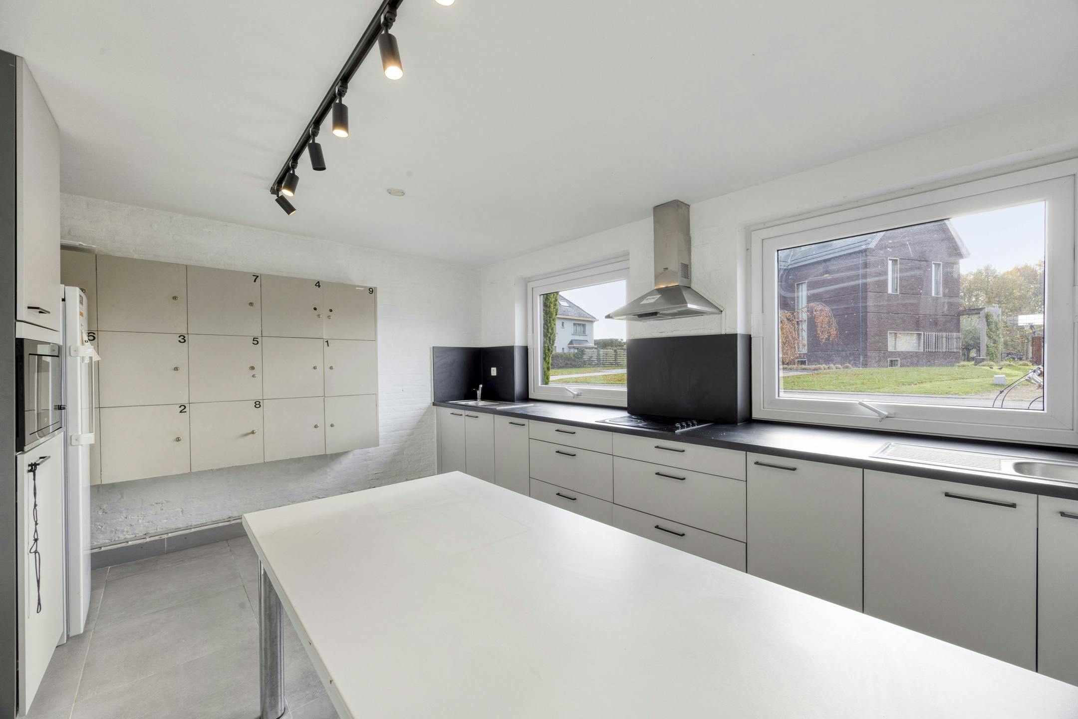 Opbrengsteigendom met 9 studentenkamers en duplex-appartement te Hasselt foto 4