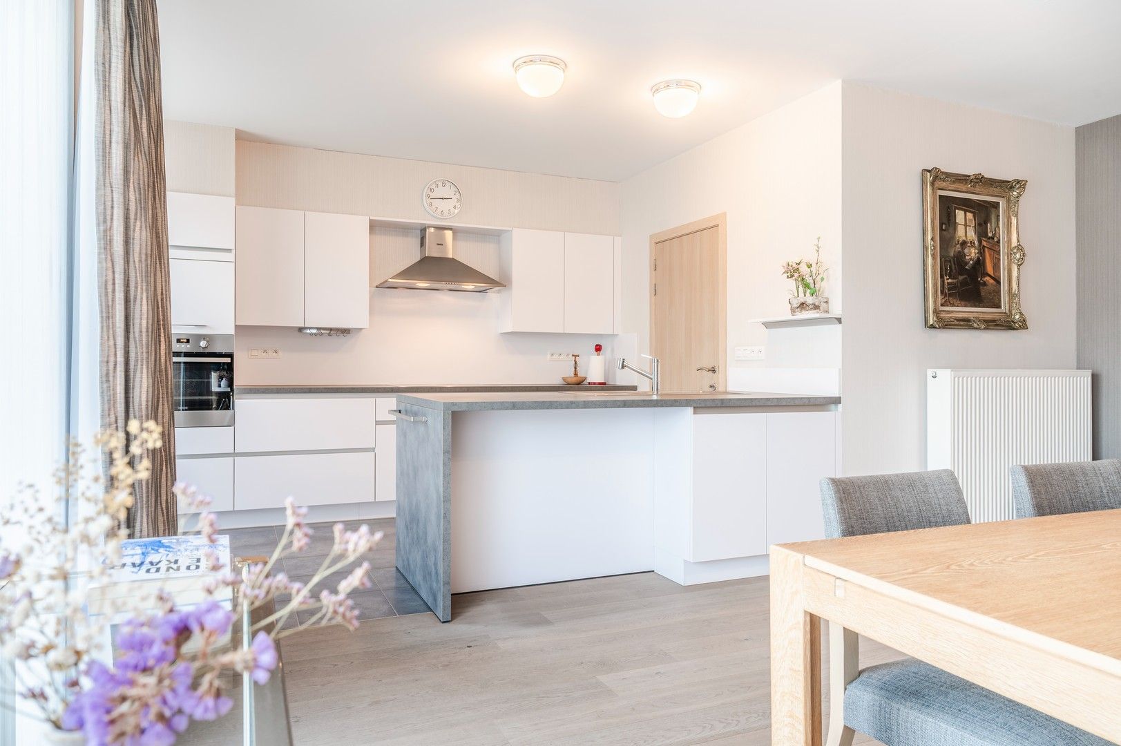 Instapklaar gelijkvloers appartement met tuin + optioneel een garage box! foto {{pictureIndex}}