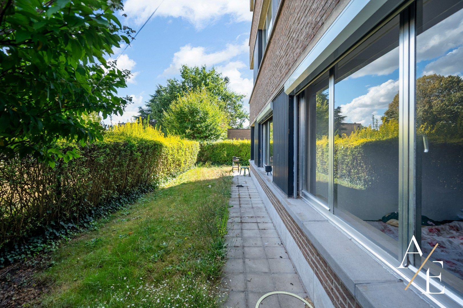 SINT-AMANDSBERG - Te renoveren gelijkvloers appartement (2slk.) met privatieve tuin foto 9