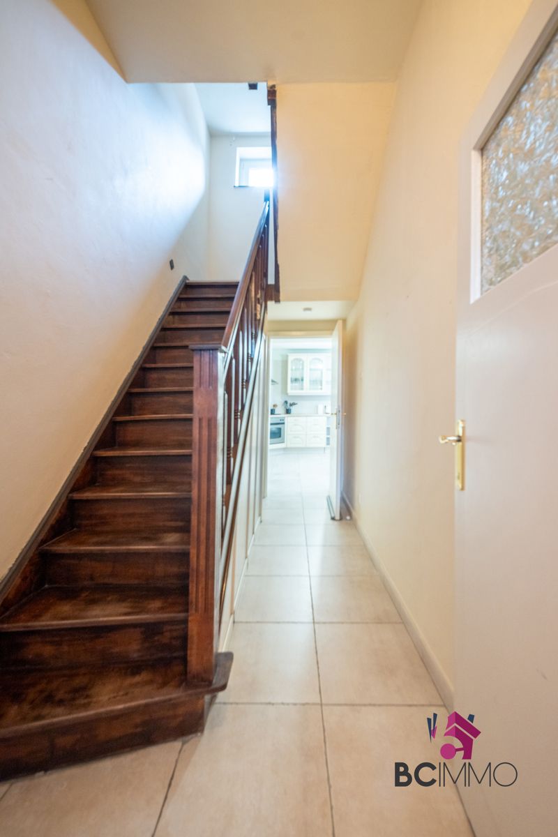 Karaktervolle woning met ruime tuin te Genk foto 12