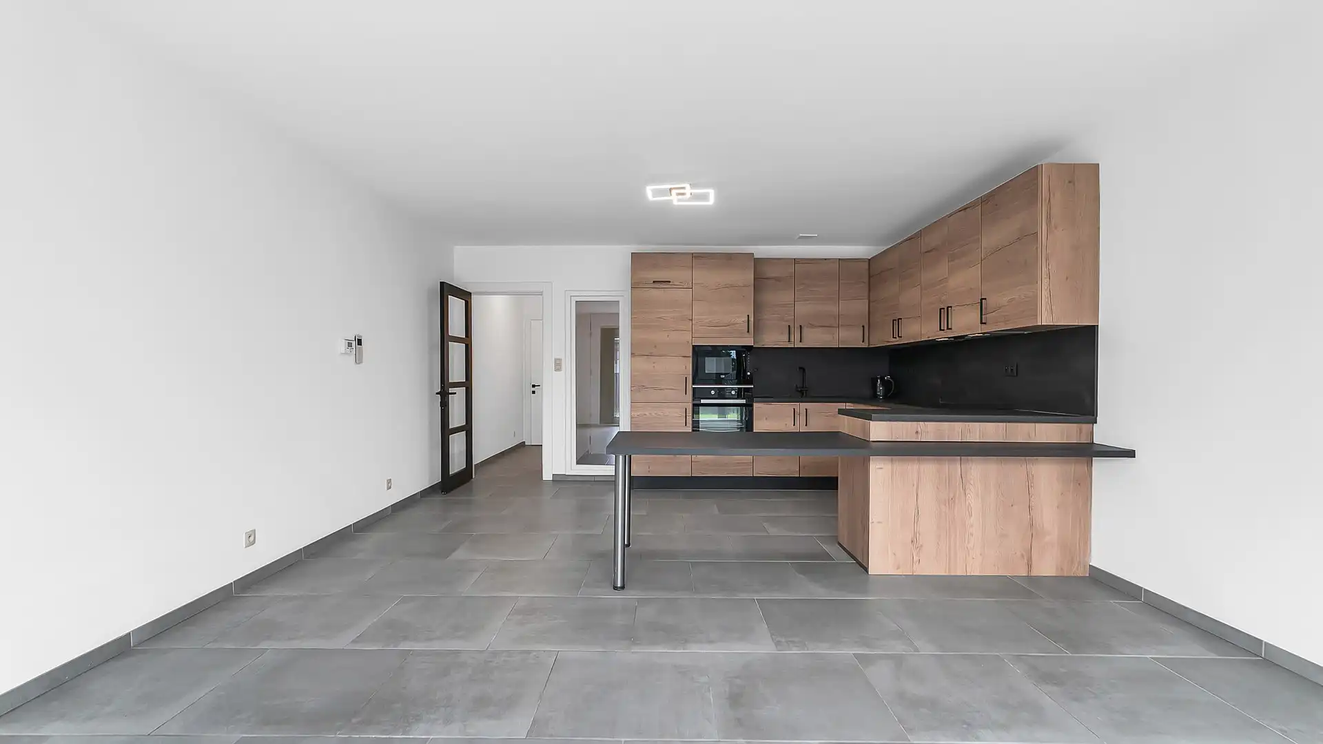 Gelijkvloers appartement met privatieve tuin, volledige onderkelderd en uitzonderlijk gunstig EPC foto 2