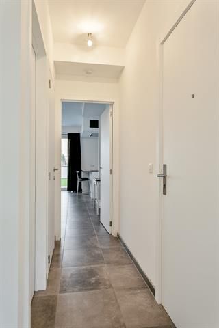 Gelijkvloers appartement met terras en tuintje foto 7