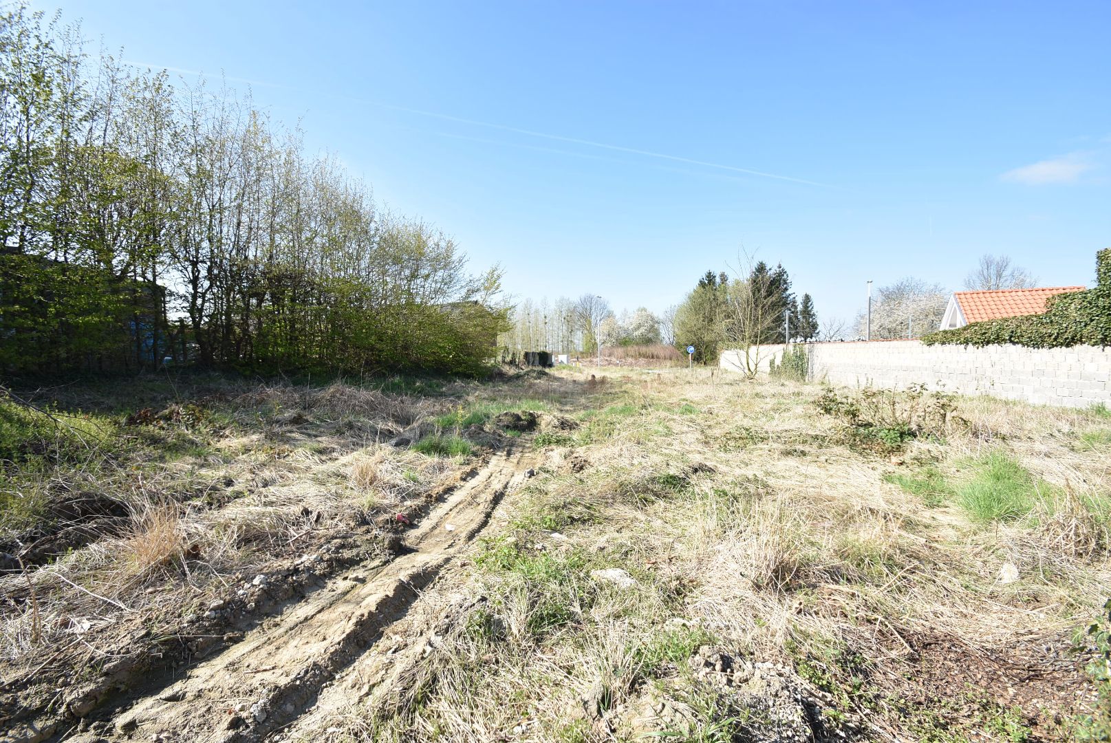 Perceel bouwgrond bestemd voor open bebouwing op 7a 96ca - 21,95 m breedte aan de straatzijde - zuid-gerichte tuin foto 4