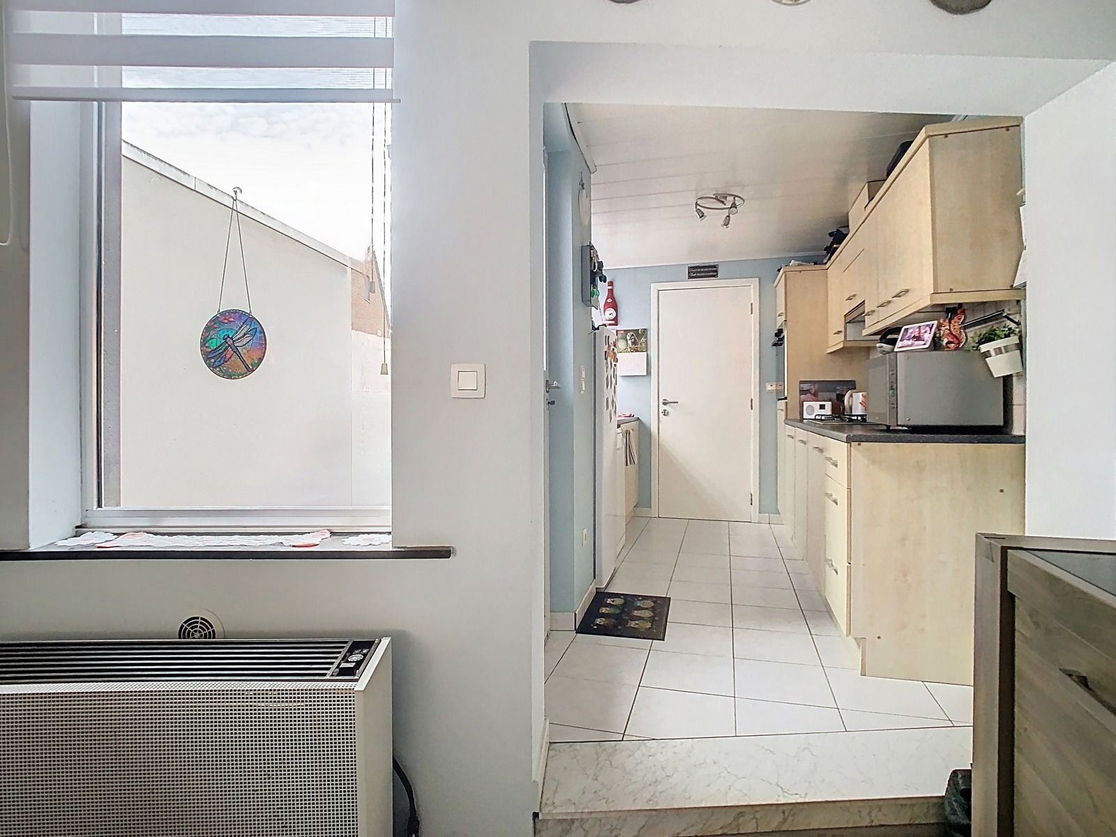 Charmante rijwoning met 3 slaapkamers én tuin, te Gijzegem! foto 4