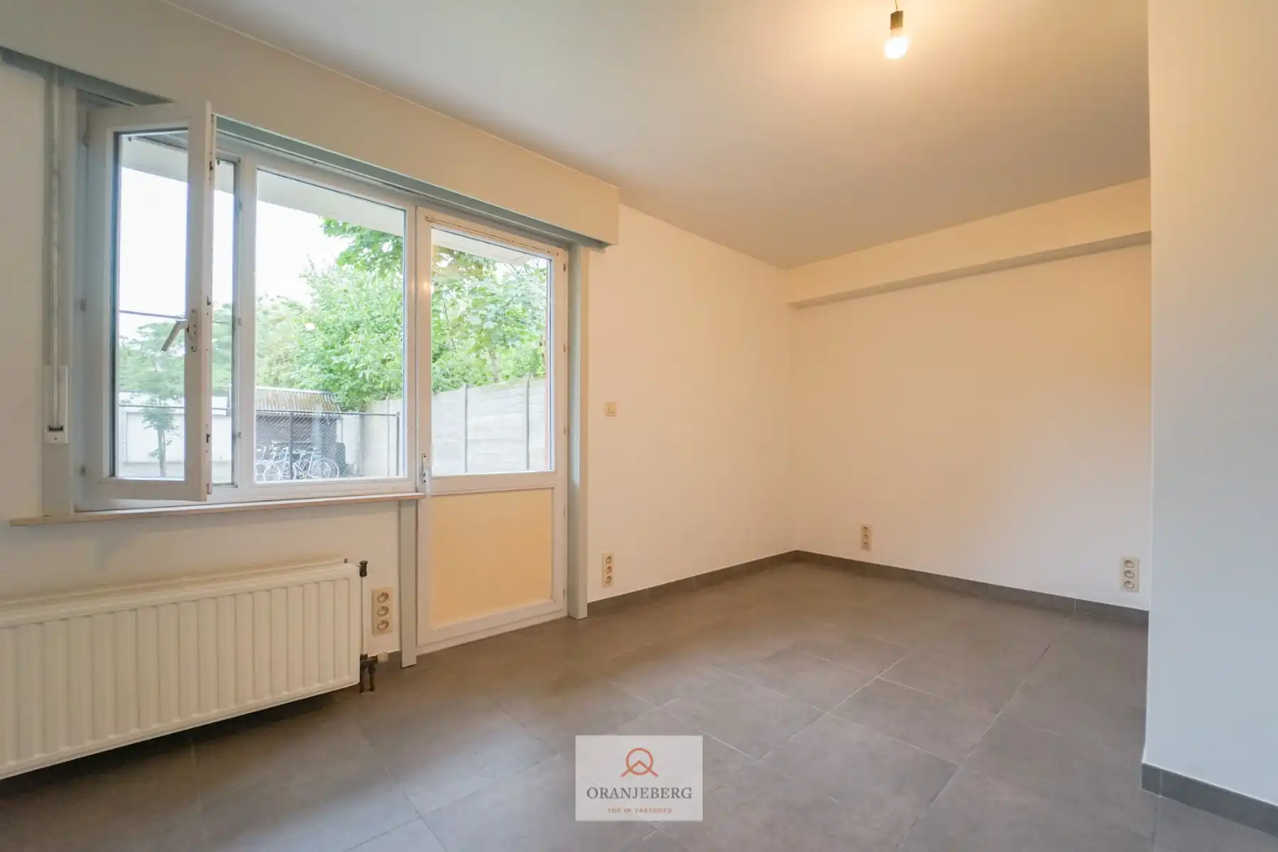 Instapklaar gerenoveerd gelijkvloers appartement met tuin foto 8