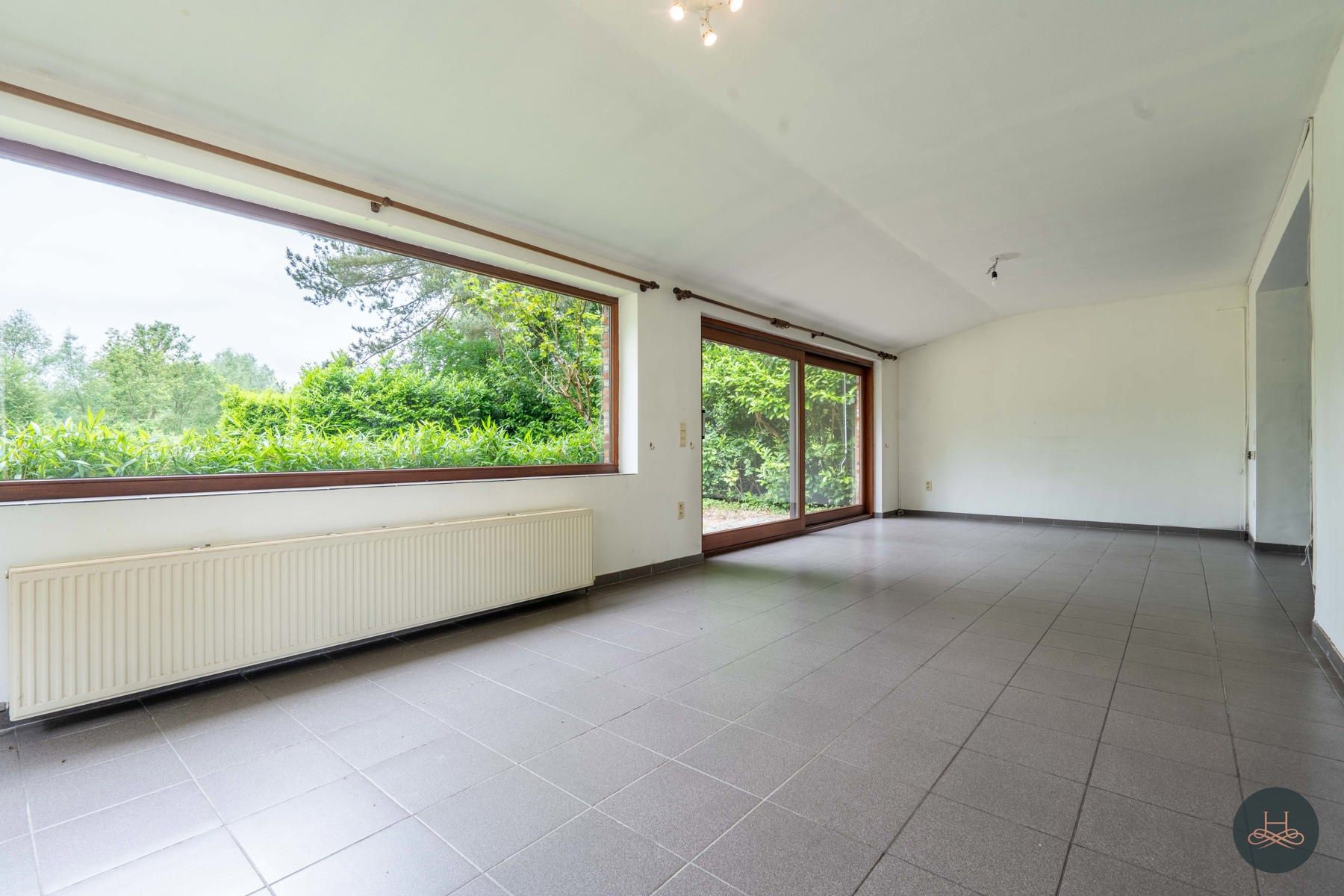 Achterliggende gezinswoning op rustgevend perceel foto 8