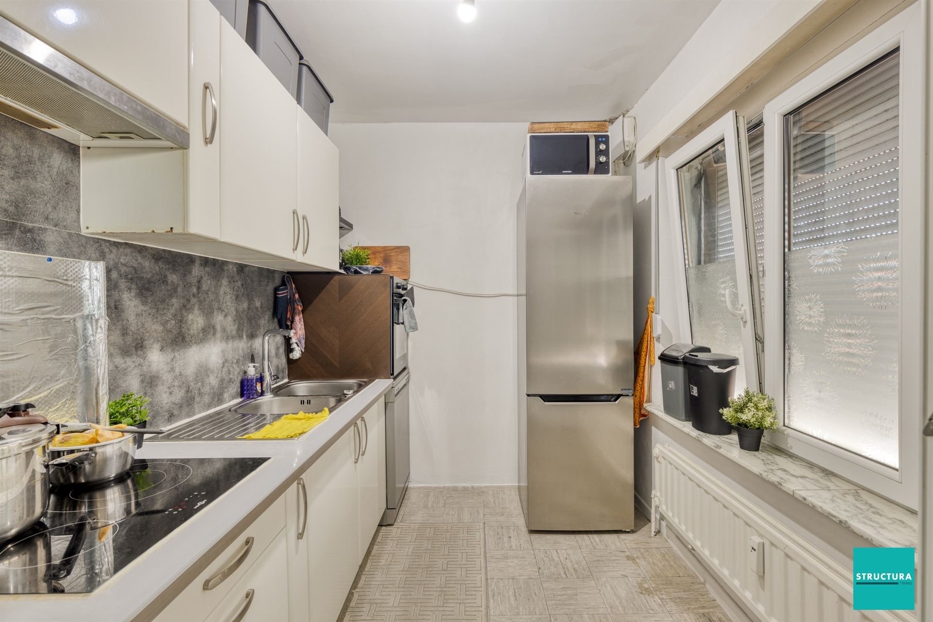 Opbrengsteigendom met 2 appartementen + 6 autostallingen foto 9