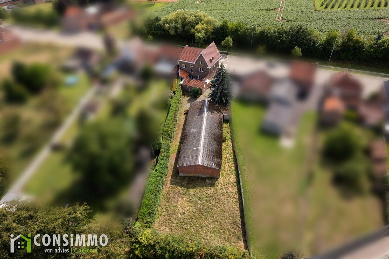 Te renoveren gezinswoning met loods en kantoorruimte op zichtlocatie in Sint-Truiden foto 6