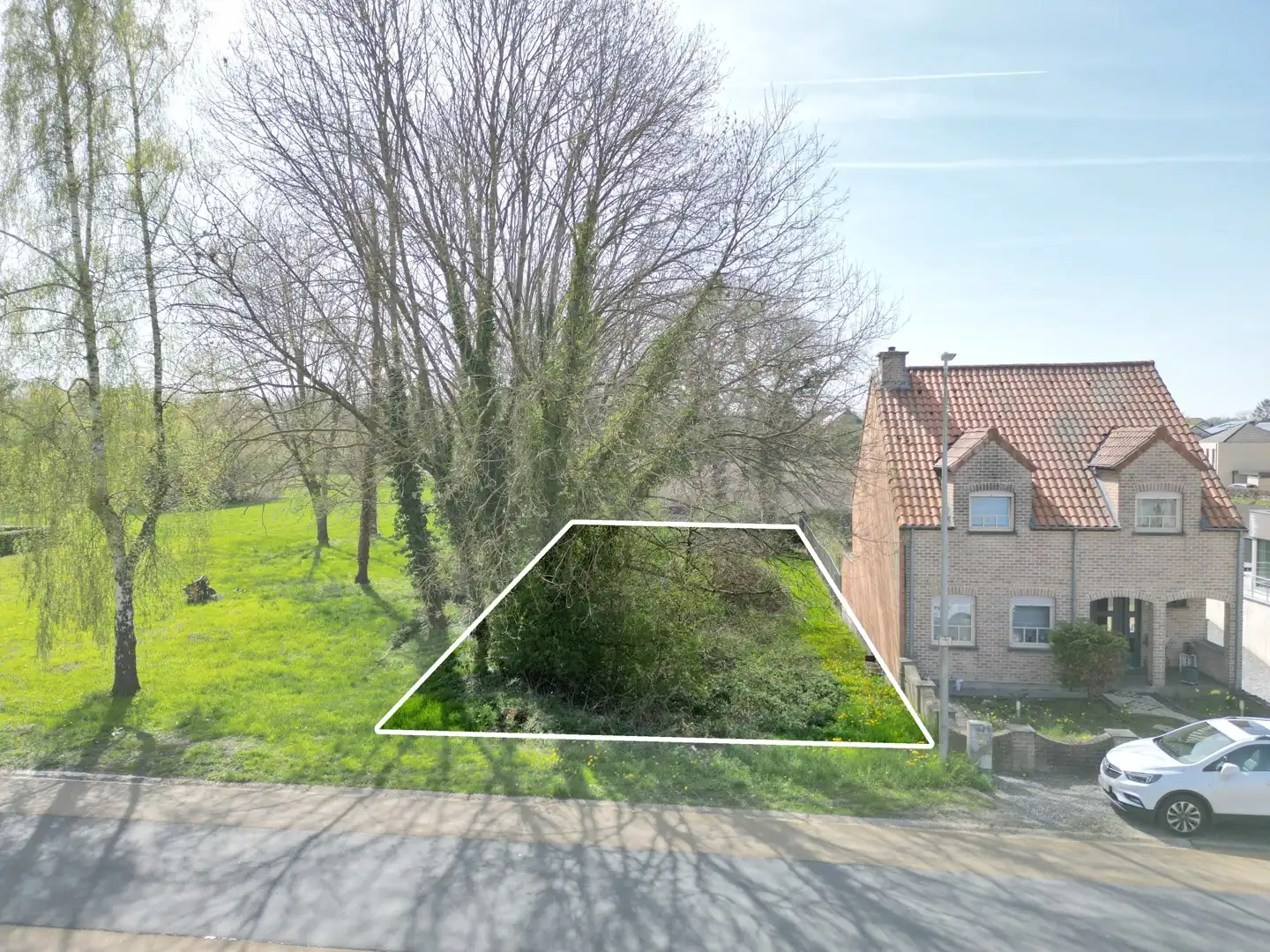 Zuid-west georiënteerde bouwgrond (Half-open) van 6a 45ca op een toplocatie in As foto {{pictureIndex}}