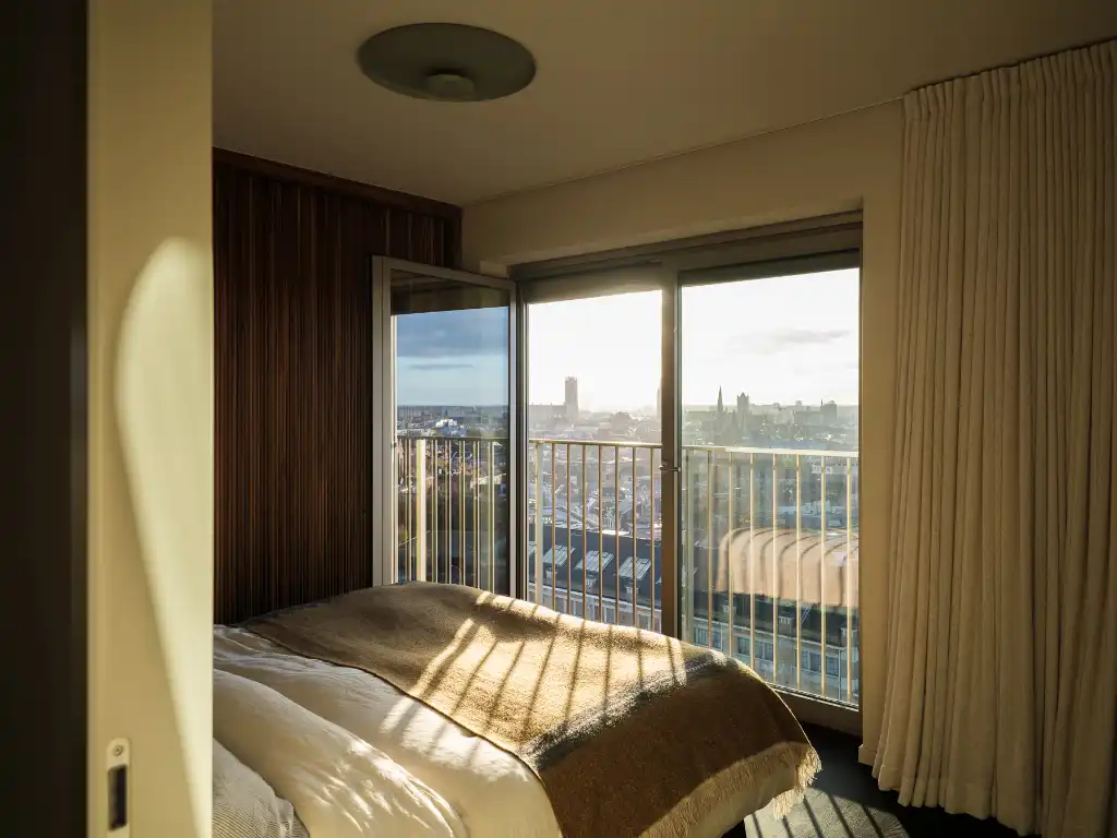 Luxe penthouse (bj. 2021) met twee kamers en een uitzonderlijk terras met panoramisch zicht over Gent en zijn torens. foto 18