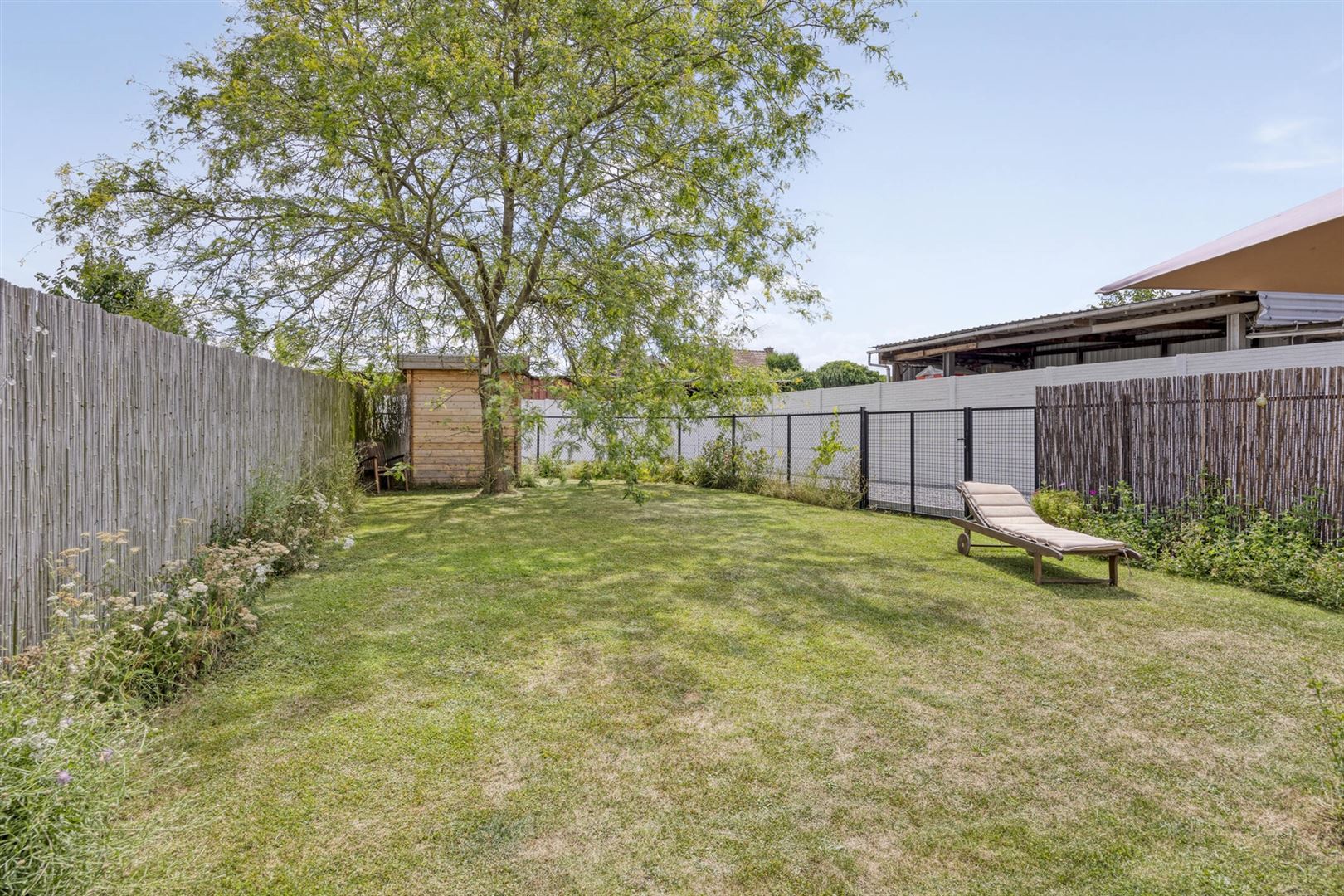 TE KOOP: Recente halfopen woning met tuin in Hoepertingen! foto 24