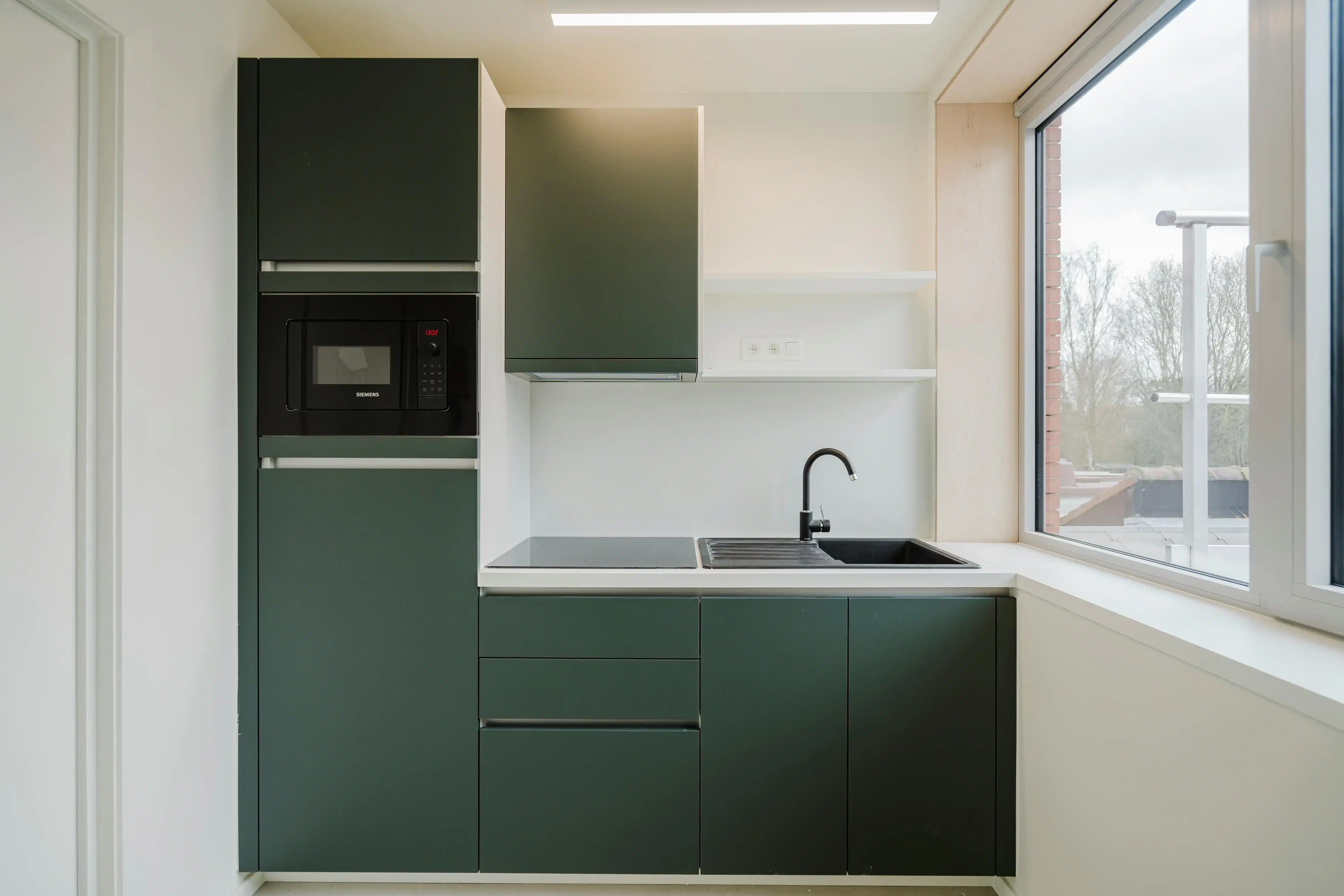 Opbrengsteigendom te koop te Kortrijk – nieuwbouw in één geheel foto 2