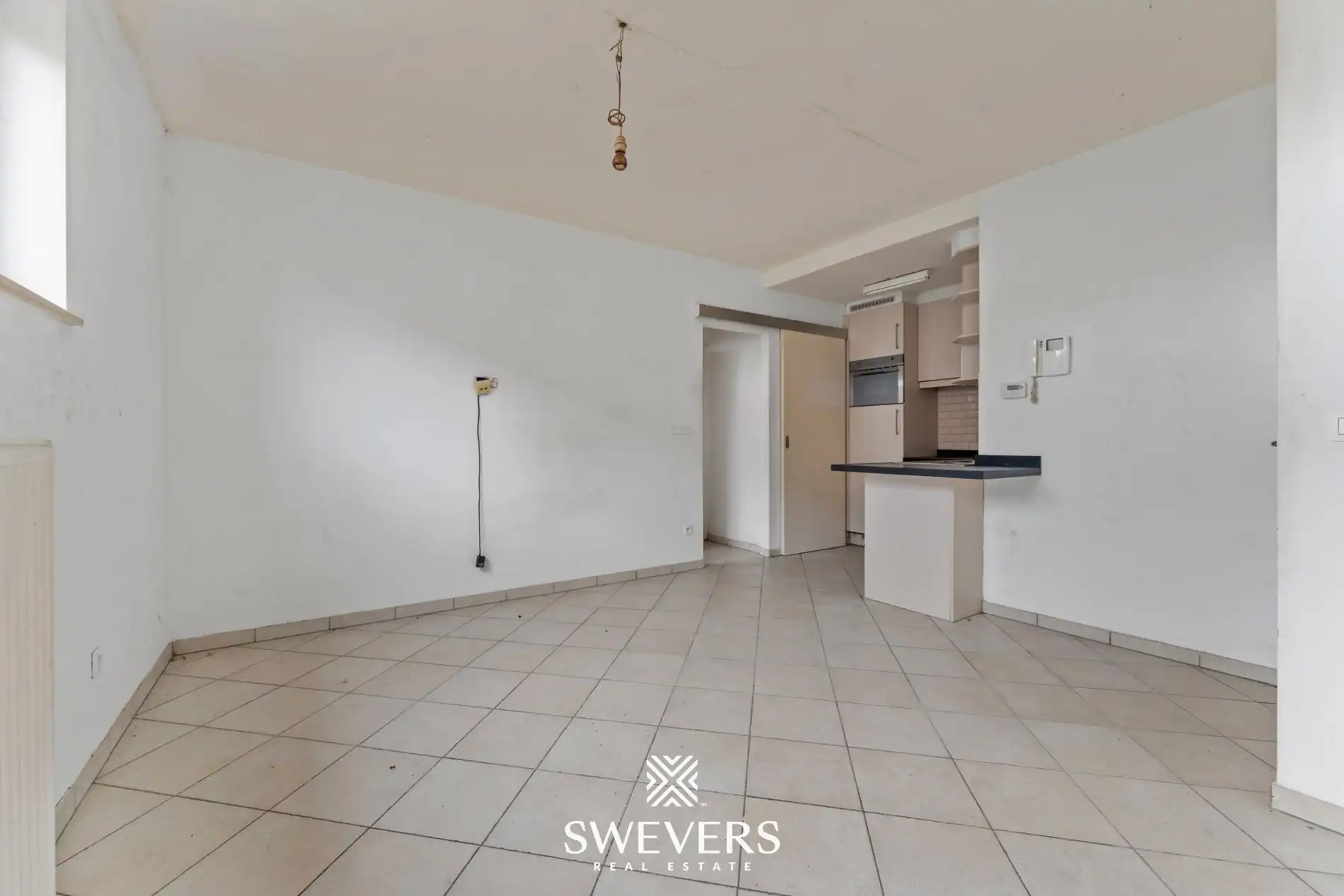 Centraal op te frissen appartement met potentieel in Halen foto 2