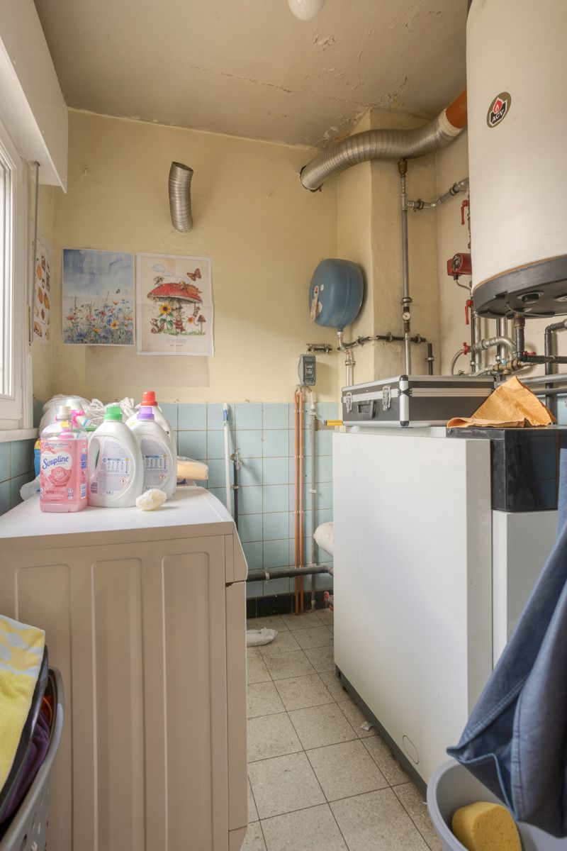Te moderniseren halfopen woning met tuin en garage foto 13