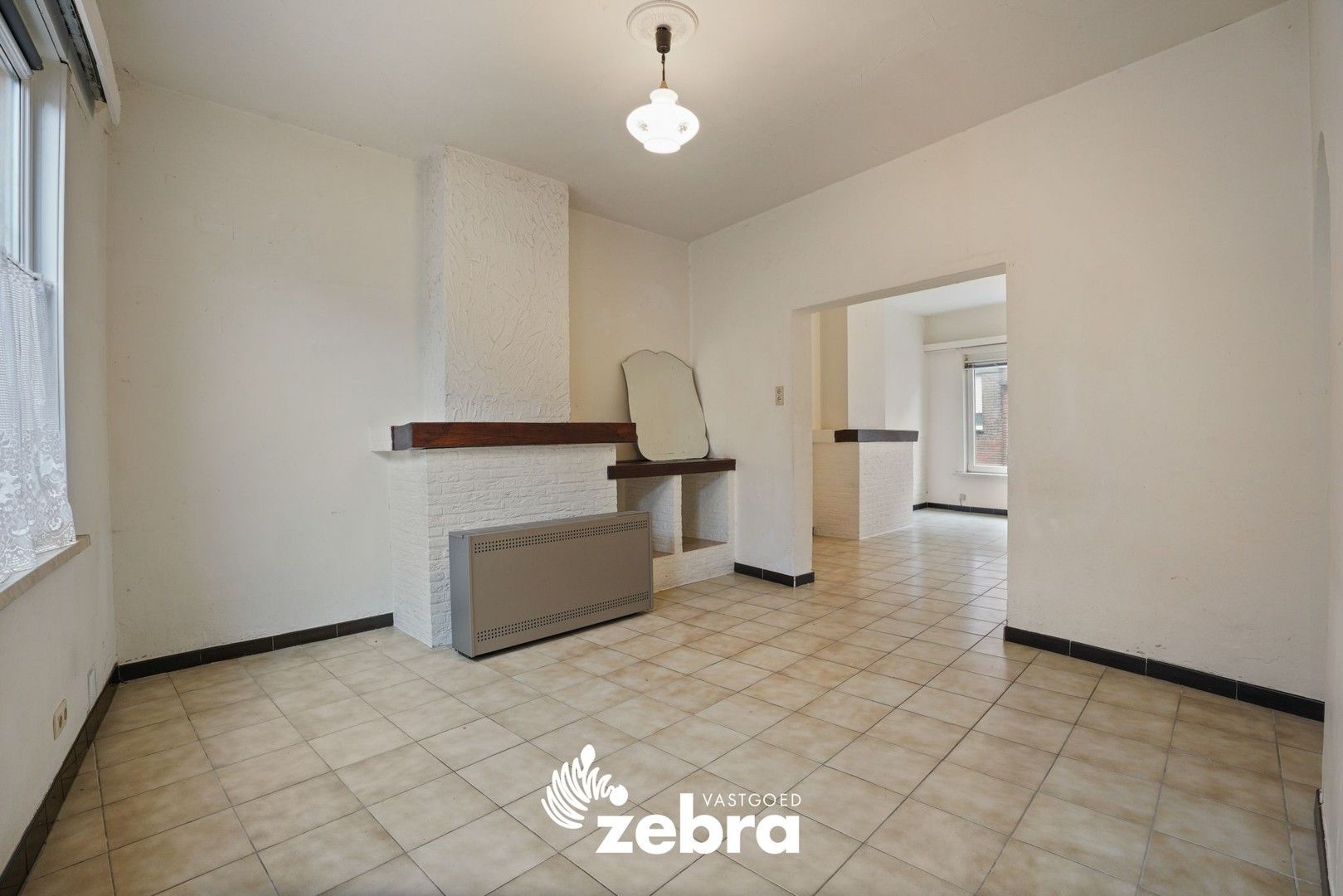 Deels gerenoveerde woning met twee slaapkamers te centrum Tielt! foto 7