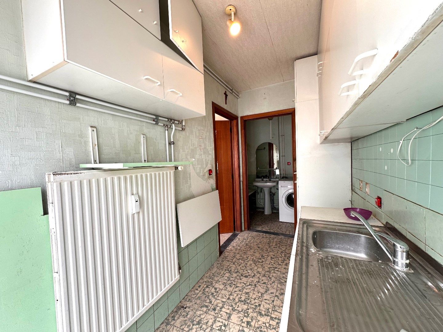 Te renoveren appartement met 2 slaapkamers en terras nabij het centrum van Tongeren foto 6