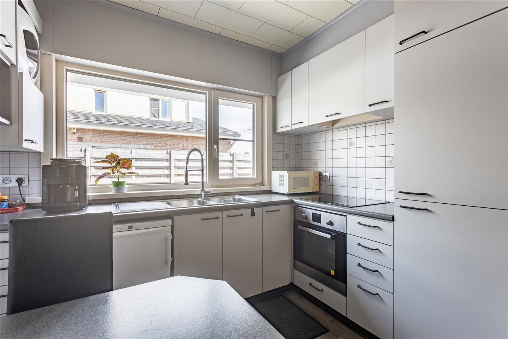 Compact wonen met tuin, garage en potentieel foto 11