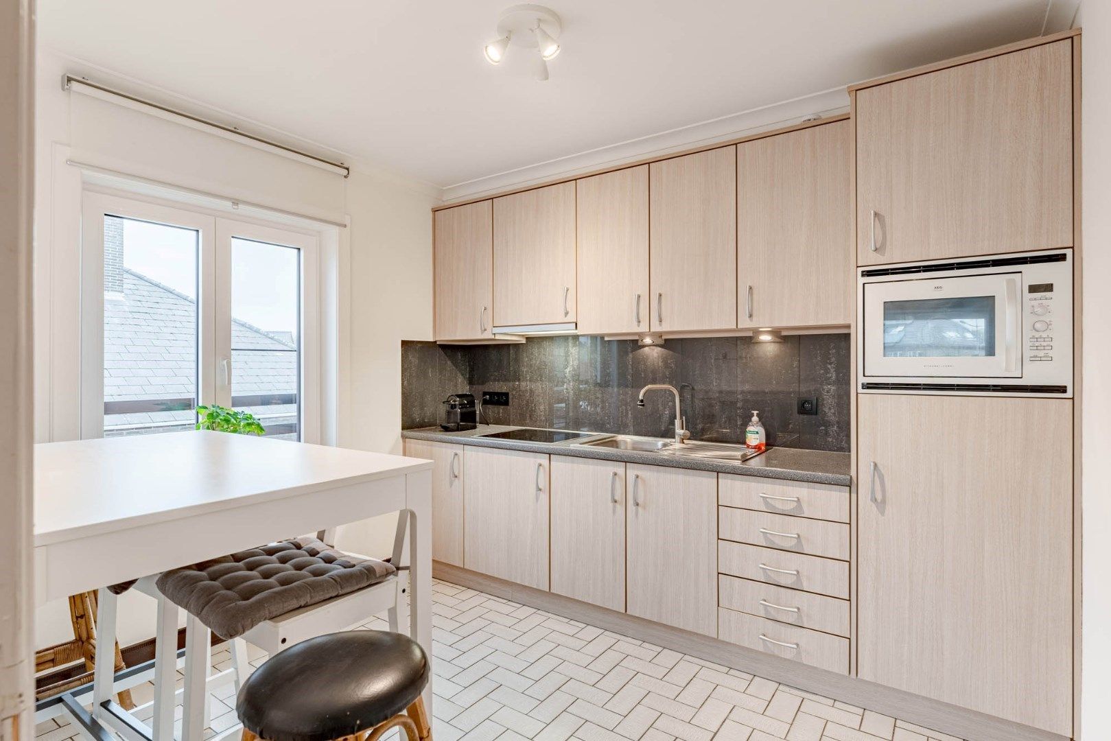 Hoofdfoto van de publicatie: Degelijk doch betaalbaar appartement met twee slaapkamers, garage en berging vlakbij het centrum van Munsterbilzen
