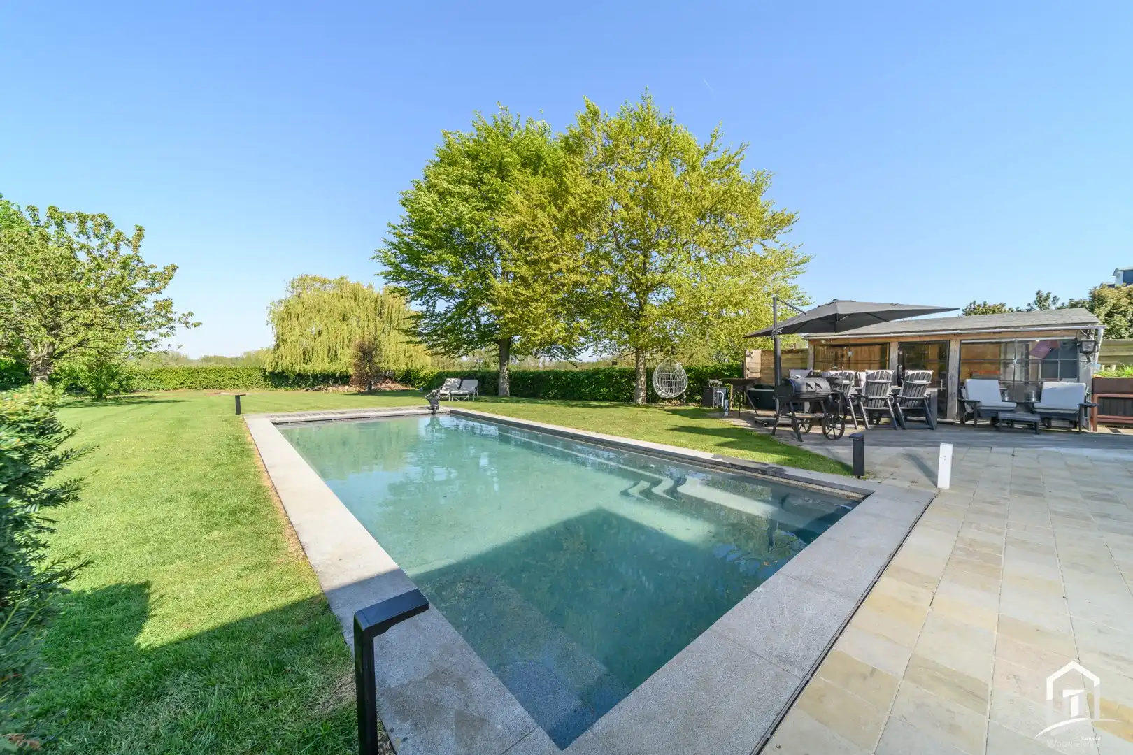 Instapklare villa met 3 SLK's, garage en riante tuin met zwembad foto 25