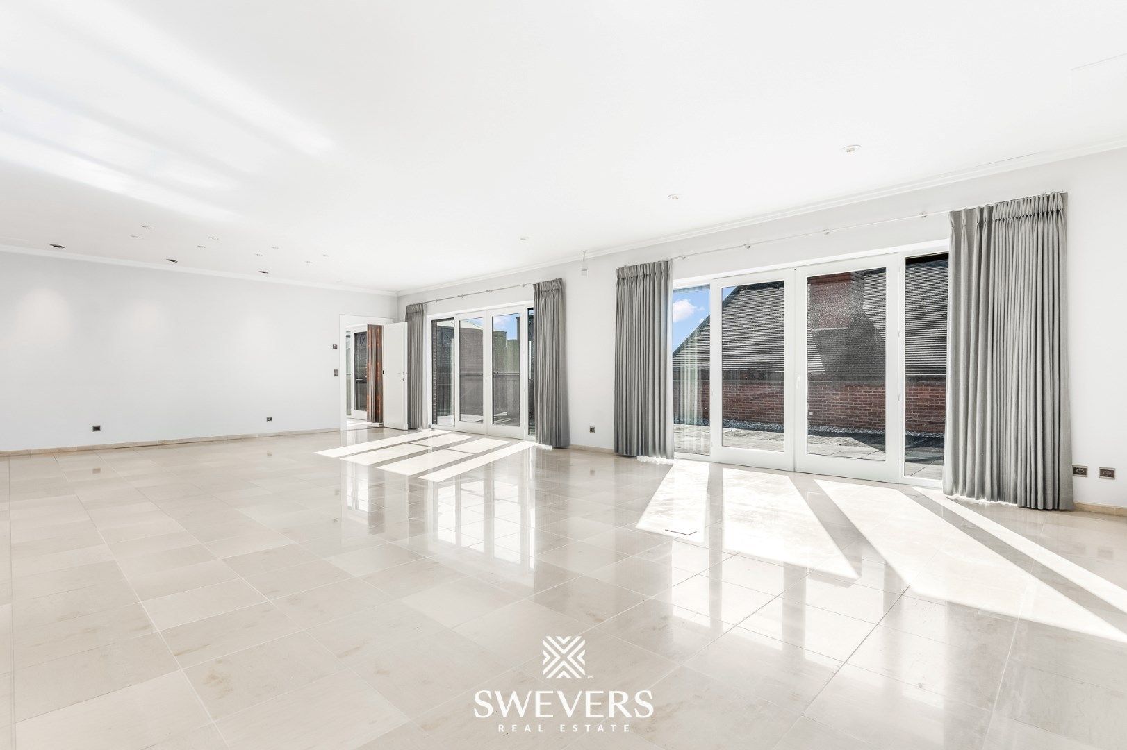 Exclusief luxueus appartement met gigantisch terras en binnentuin gelegen in hartje Lummen ( 408 m2 ) foto 2