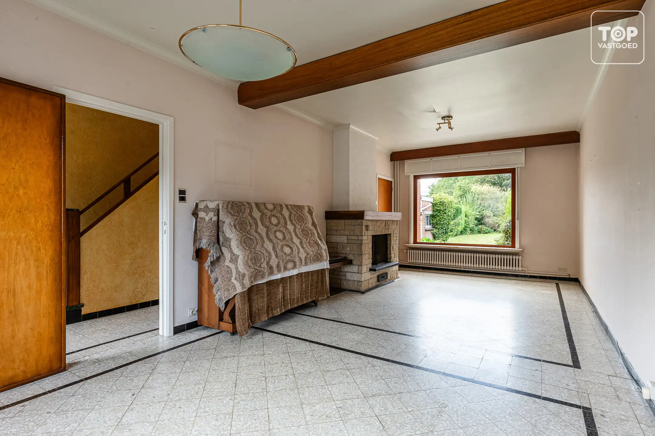 Te renoveren halfopen bebouwing met 3 slaapkamers, garage en ruime tuin op perceel van +-600 m² foto 4
