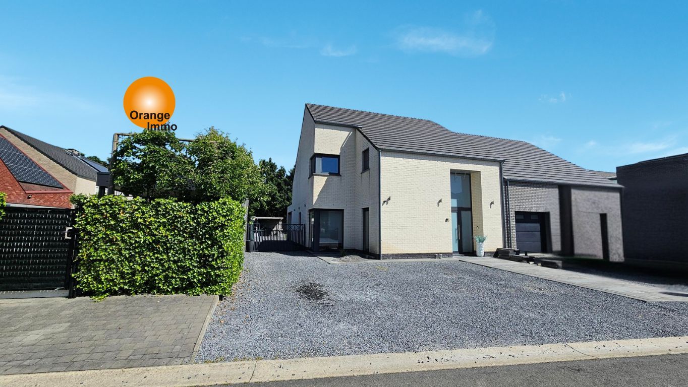 Knappe moderne woning met een mooie tuin  in Dilsen-Stokkem. foto {{pictureIndex}}