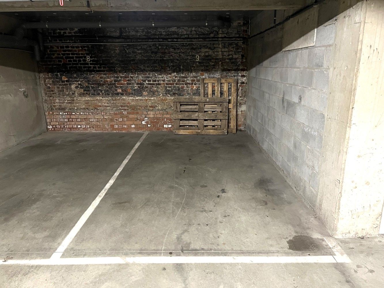 Gerenoveerde duplexstudio met aparte slaapkamer en ondergrondse parking gelegen op goede locatie in centrum Leuven foto 19