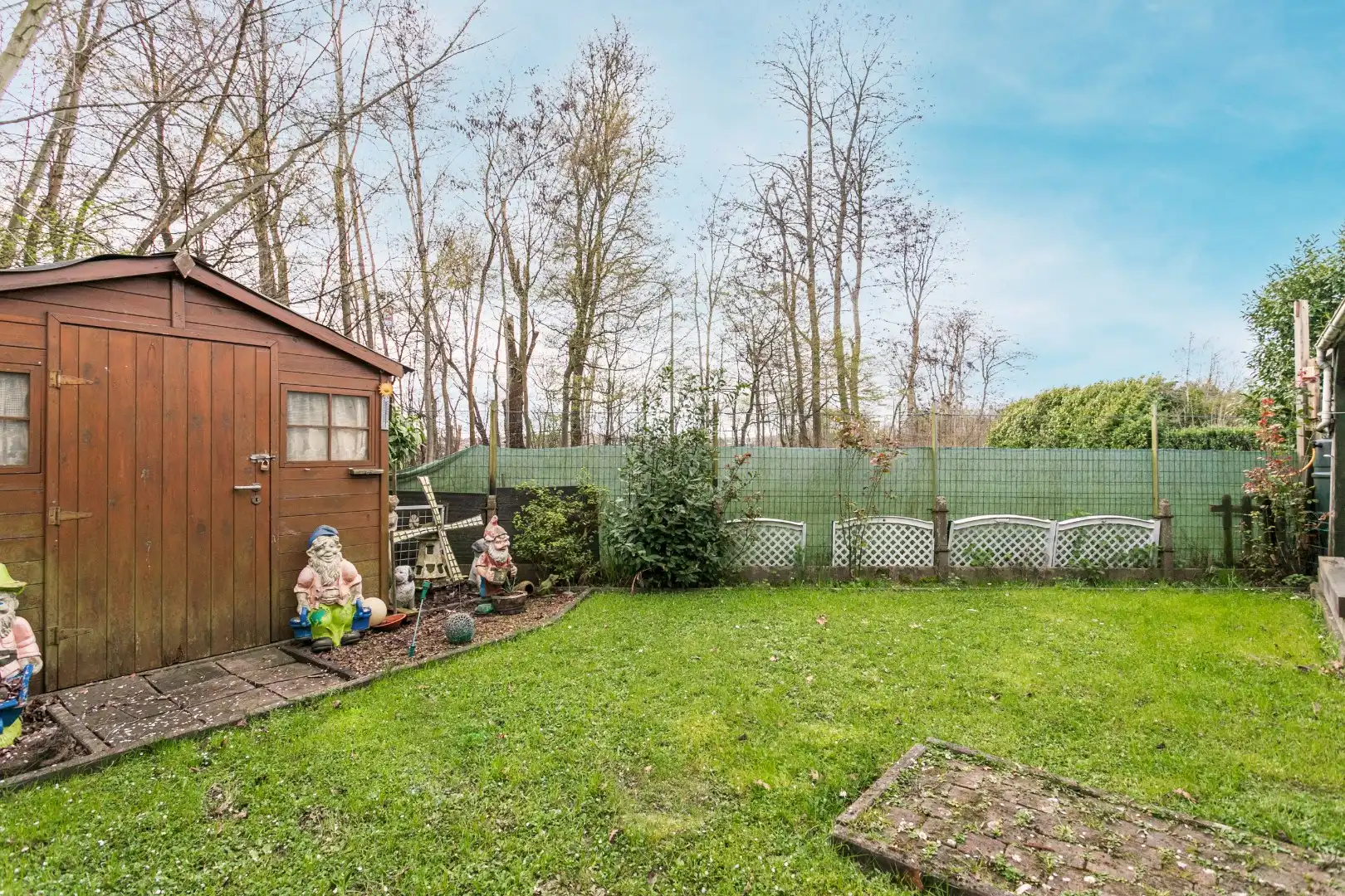 Solide woning te koop met 3 slpks, garage, veranda en tuin foto 10