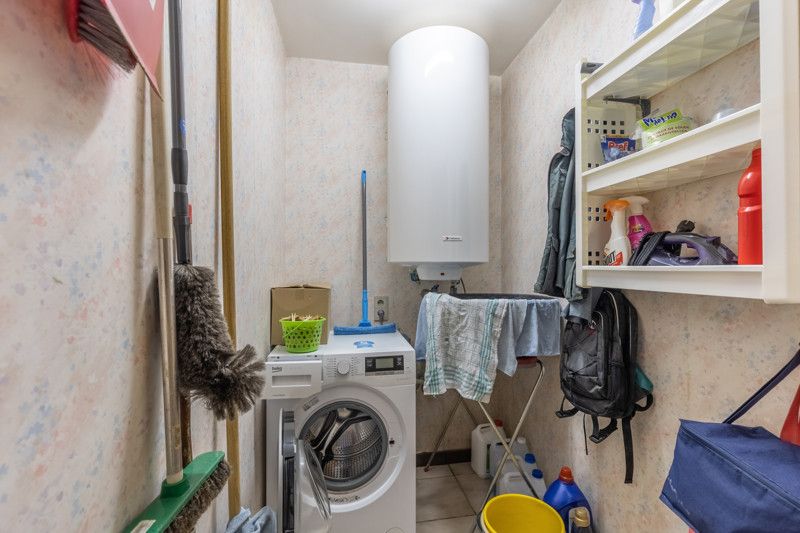 Gelijkvloers appartement met 2 slpkms, autostaanplaats en private berging foto 24