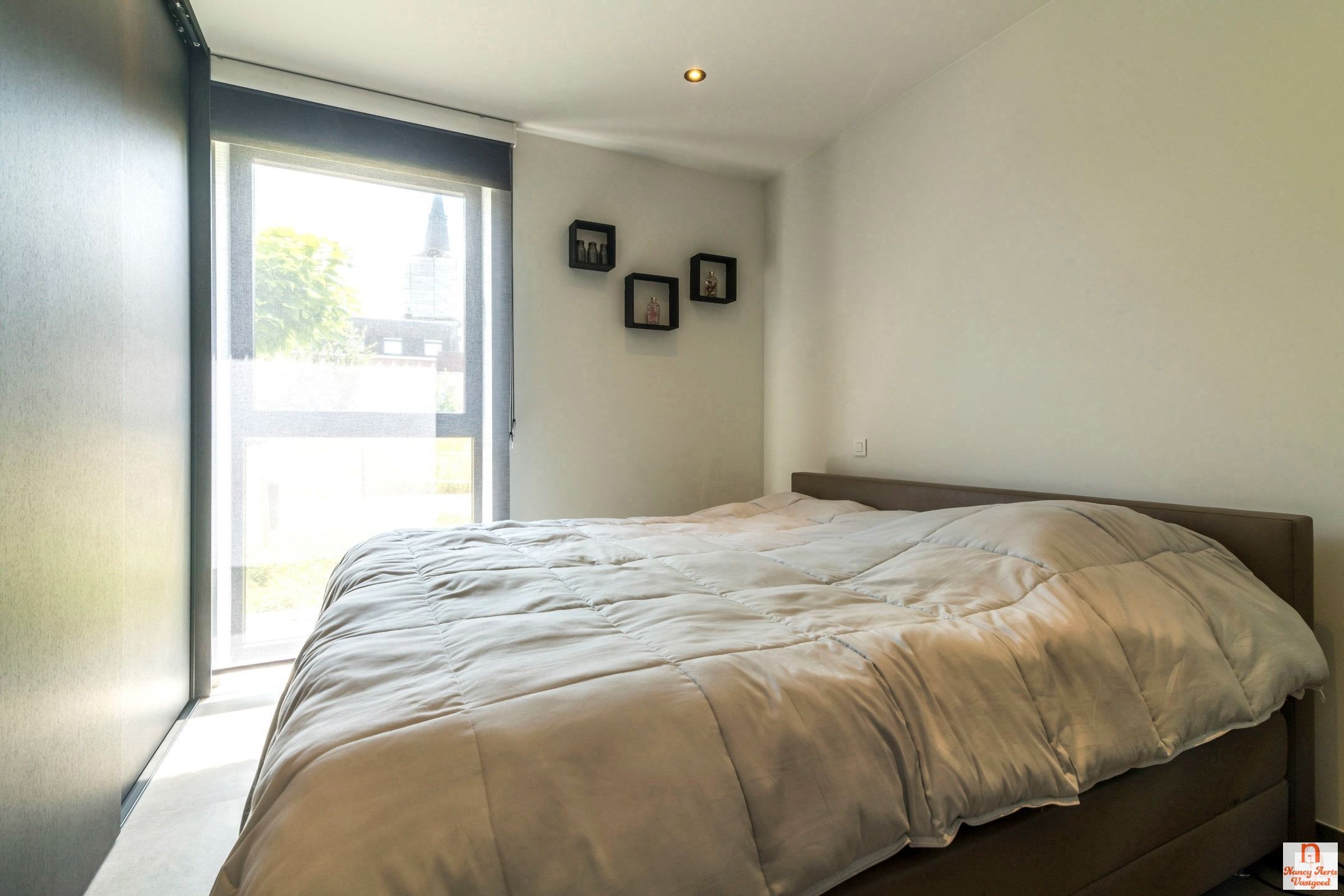 Ruimtelijk wonen met verfijnde afwerking in hartje Koersel foto 23