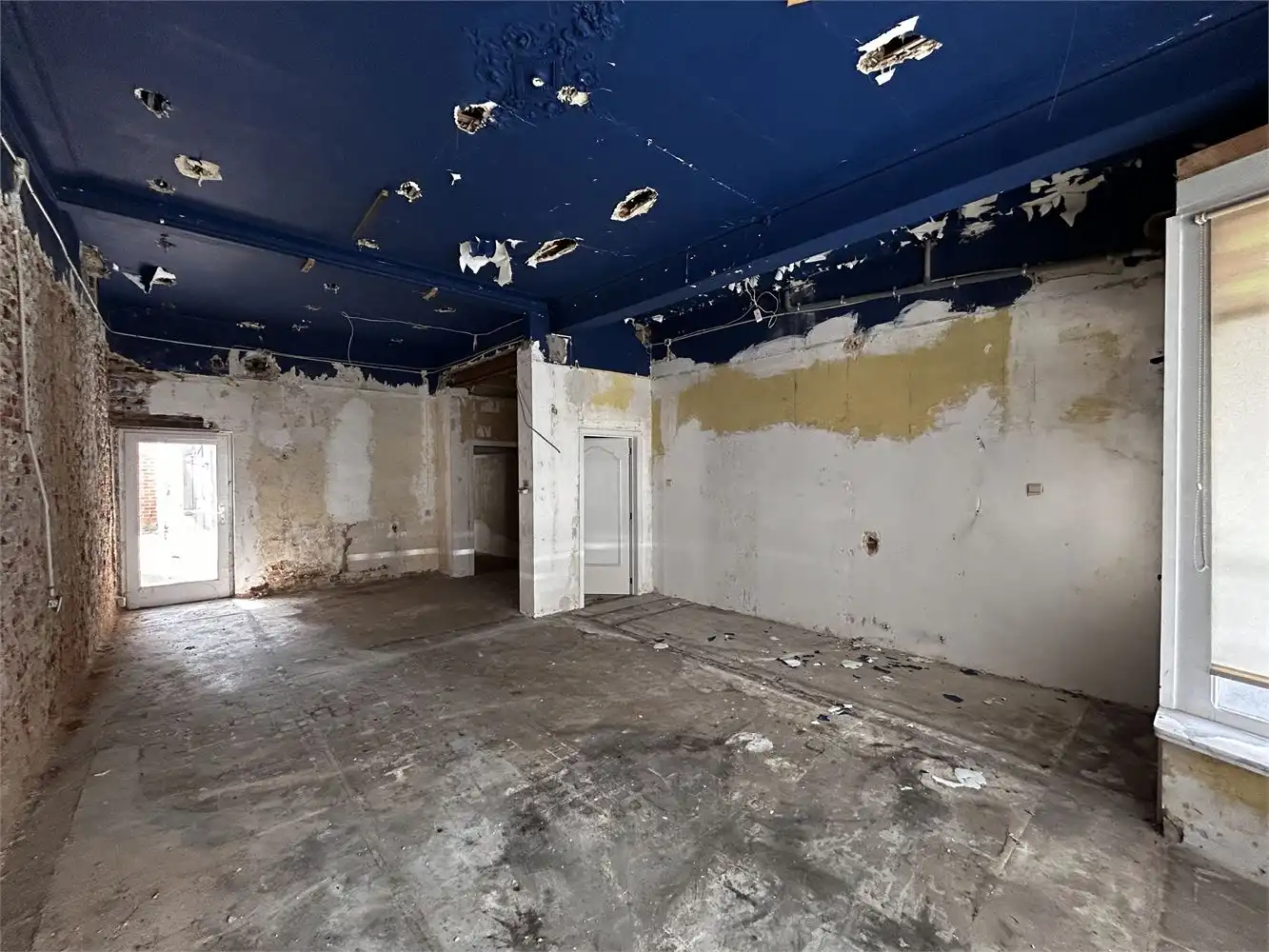 Te renoveren handelshuis met woonst foto 8