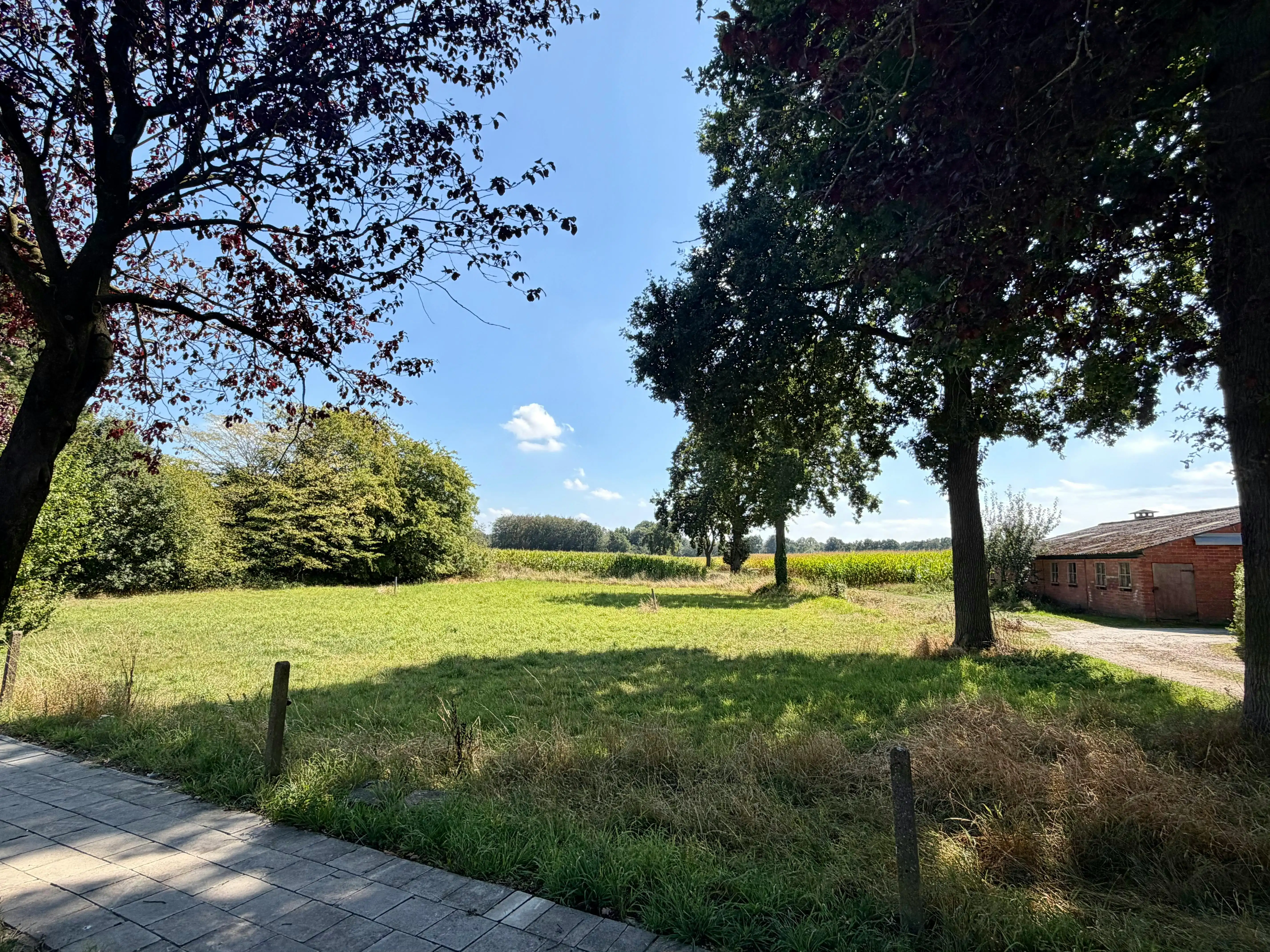 Zuidgerichte bouwgrond met zicht op velden te koop - Brecht foto {{pictureIndex}}