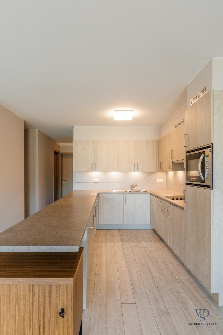 Gelijkvloers 2 slpk-appartement met terras foto 13