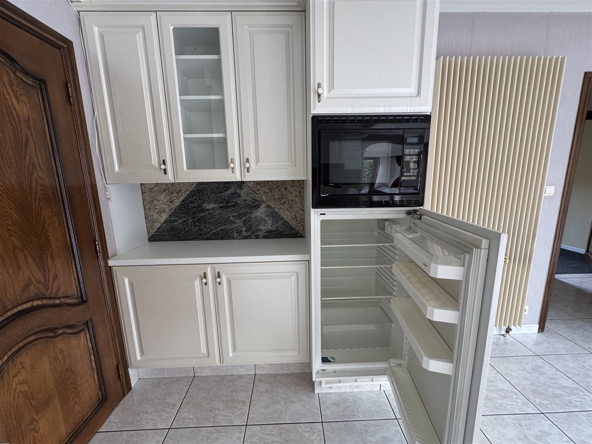 GOED ONDERHOUDEN GELIJKVLOERSE WONING MET 2 SLAAPKAMERS EN LEUKE VERANDA TE HAM foto 8