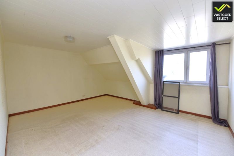 Vastgoed Select: Halfopen bebouwing met zonnige tuin, garage en renovatiepotentieel in Eeklo foto 9