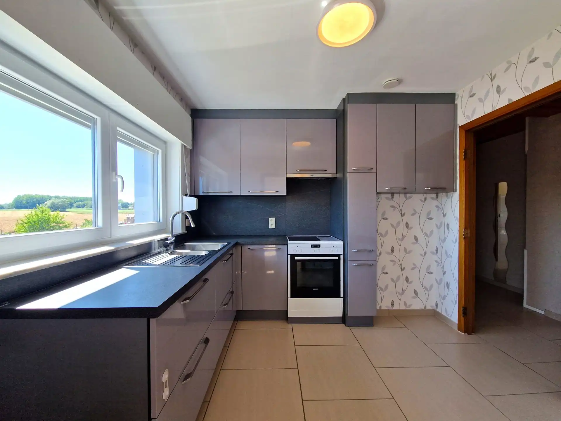 Appartement met 3 slpkmrs, tuin en garage nabij het station foto 3
