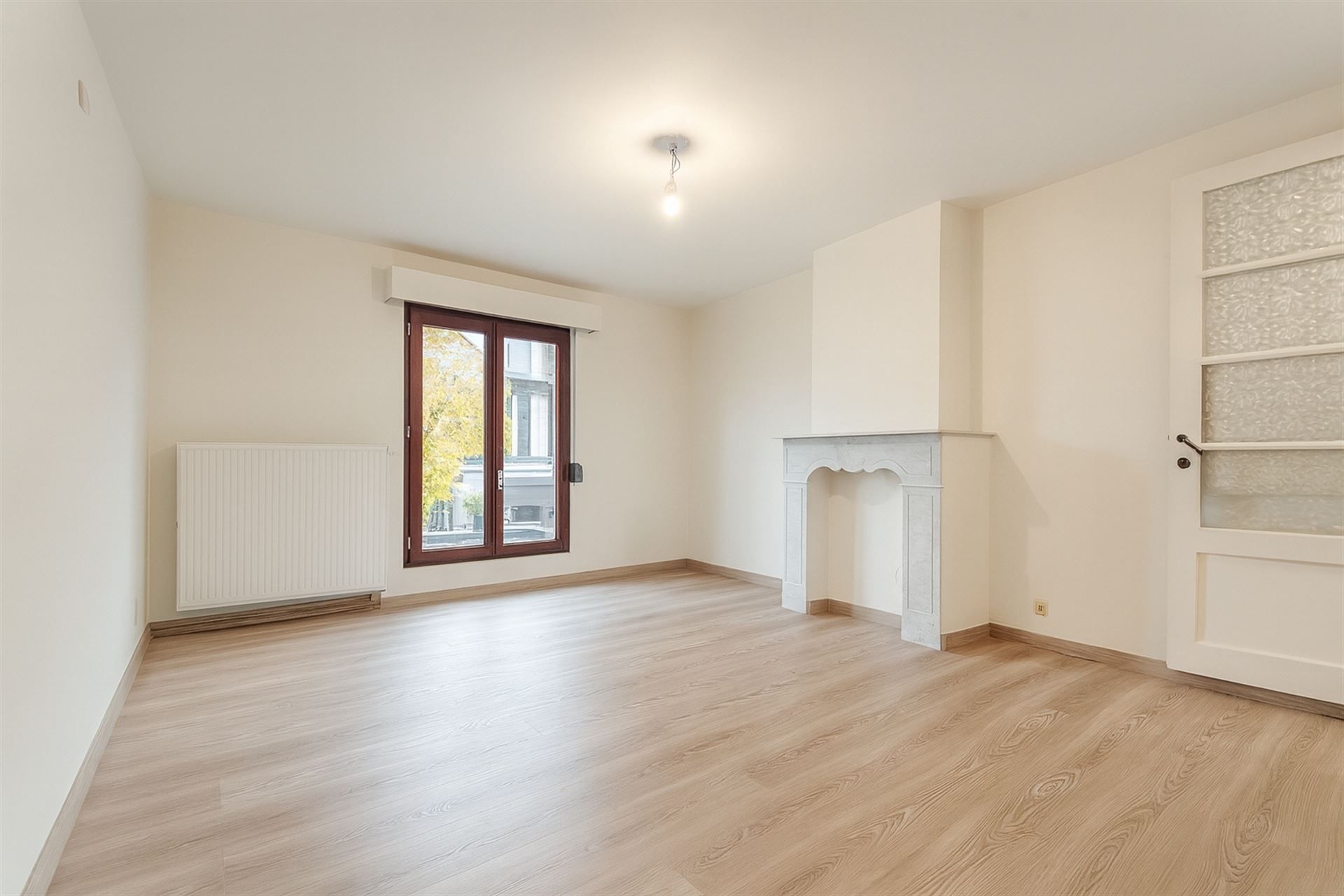 Stadswoning met 2 slpks, garage en terras foto 7