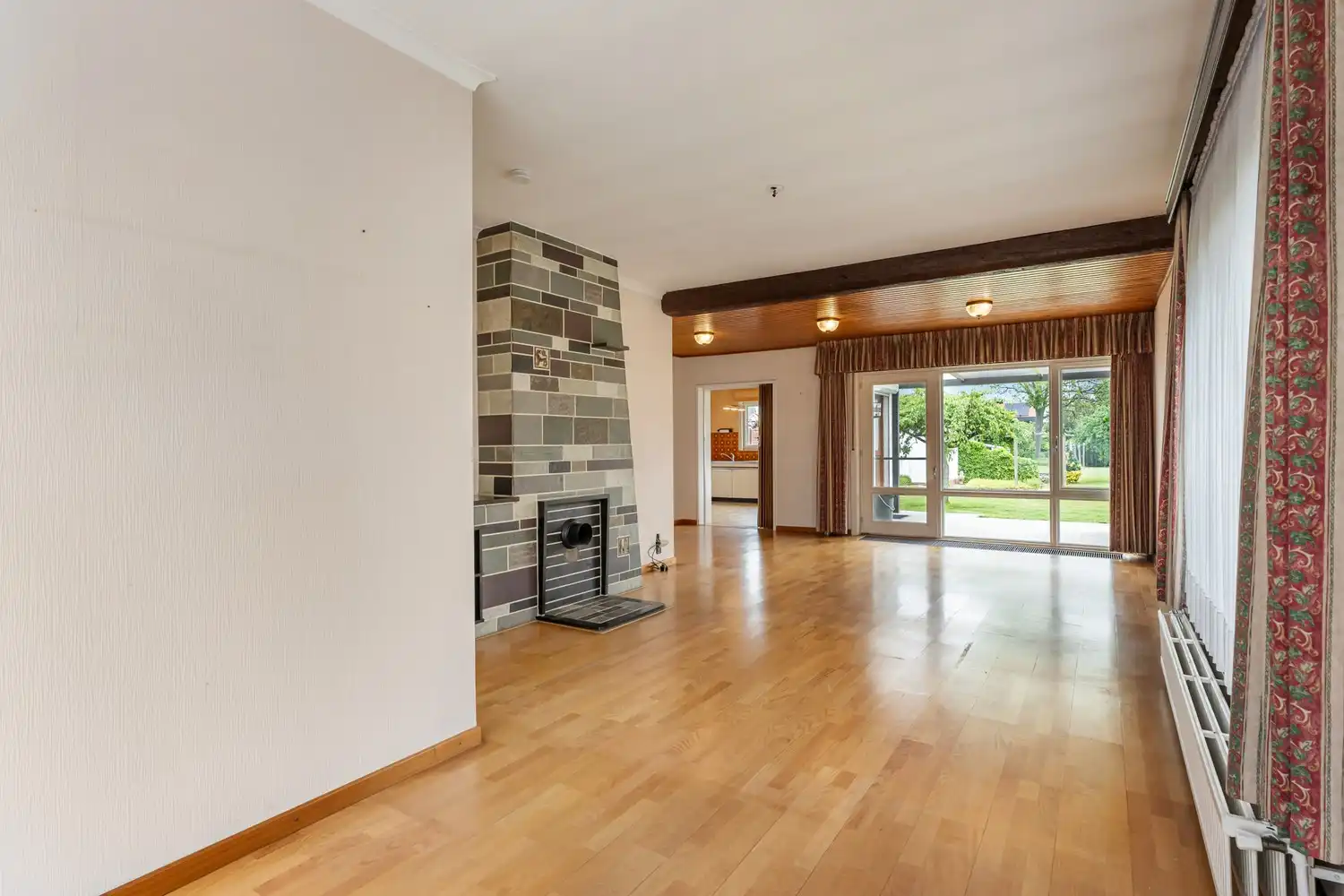 Goed gelegen woning met 4 slaapkamers, een garage en een diepe tuin in een verkeersluwe straat te Kessel-Lo! foto 4
