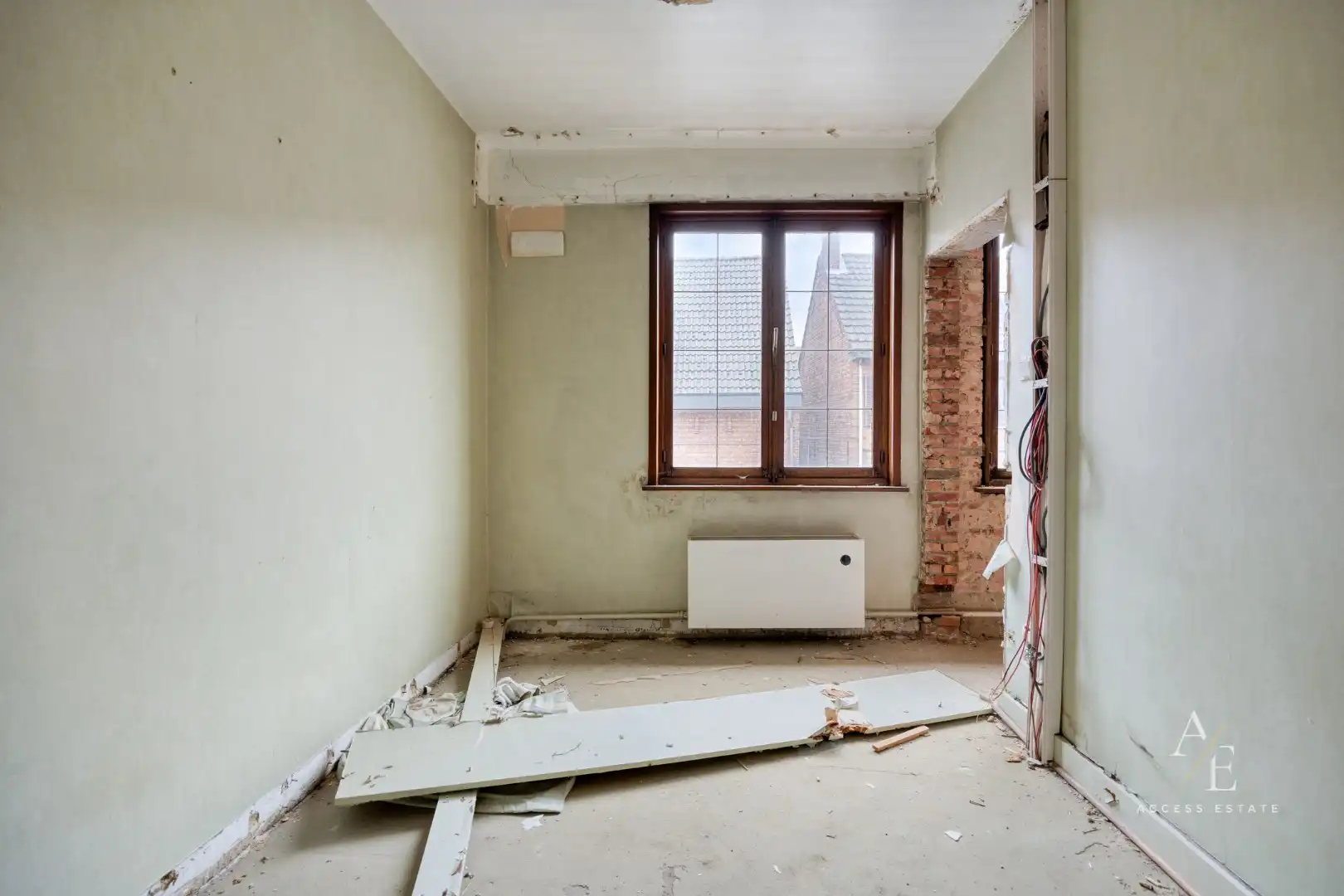 Veelzijdig te renoveren eigendom met tuin en 2 garages en achterdoorgang in Temse foto 15