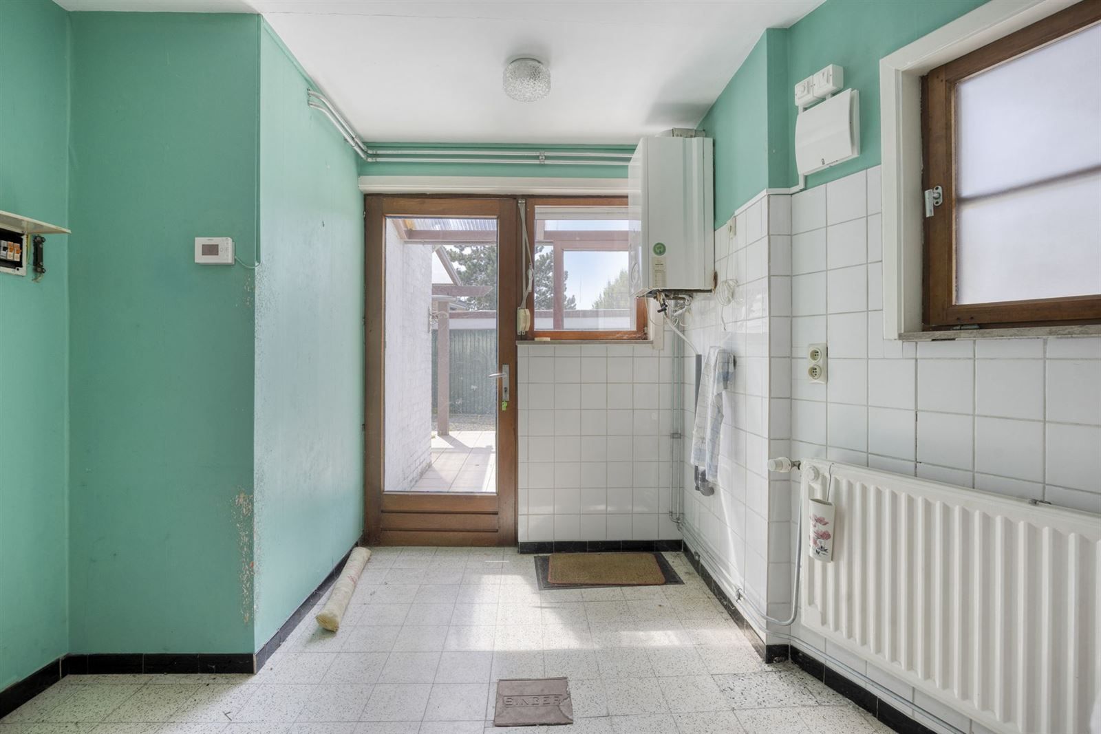 Opbrengstwoning met 2 appartementen en 3 garageboxen foto 10