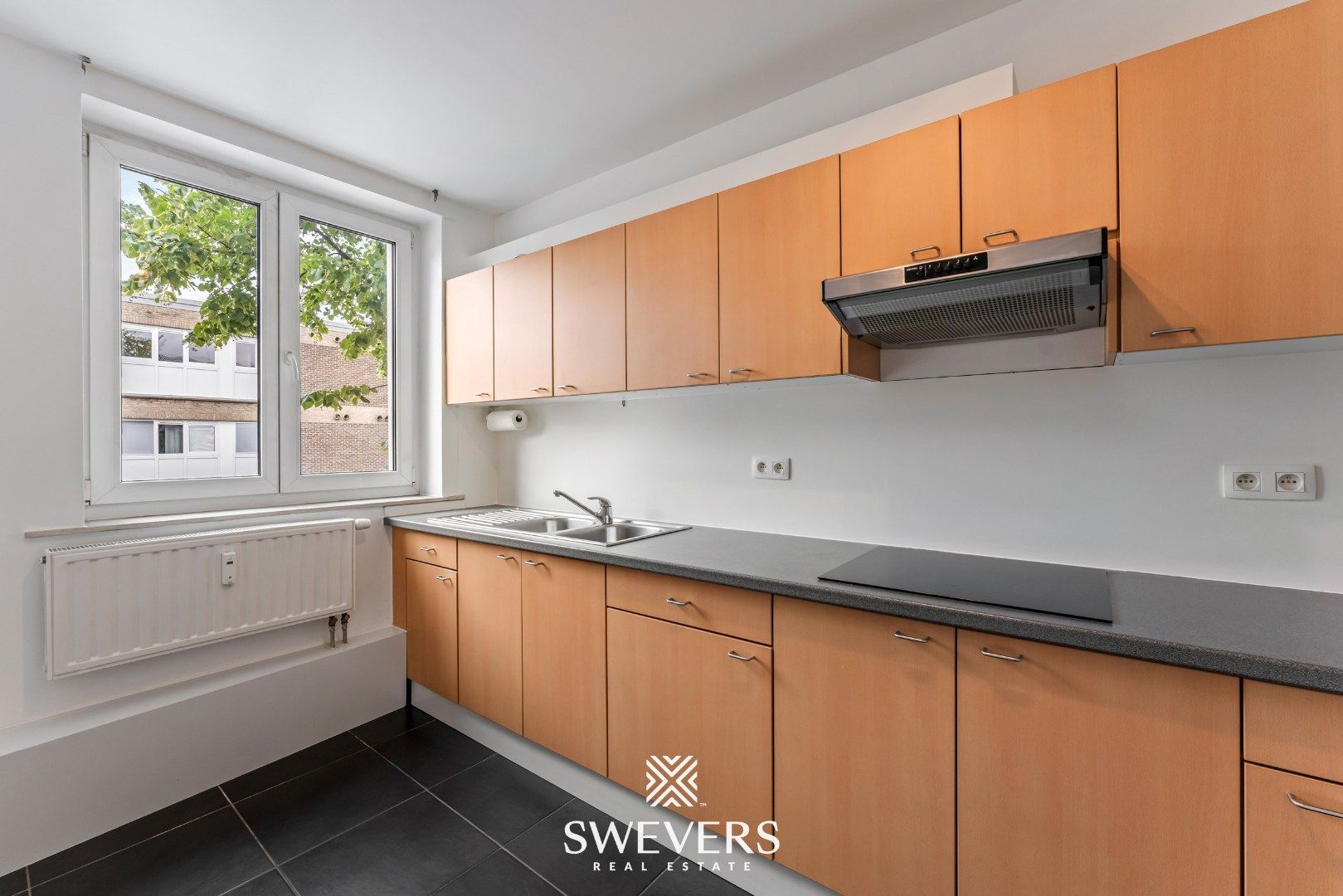 Instapklaar en energiezuinig 2-slaapkamerappartement in het centrum van Heppen foto 13