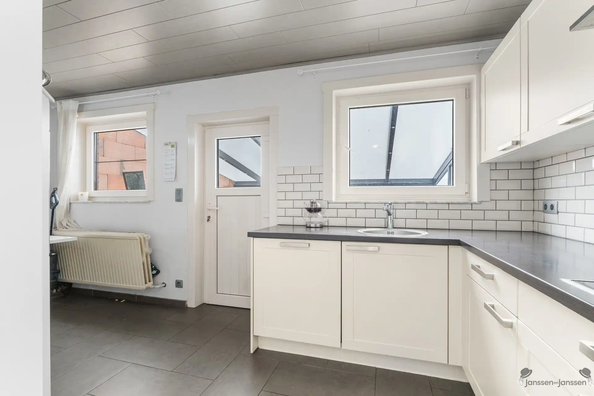 Charmante rijwoning met tuin in het groene Waterschei foto 10