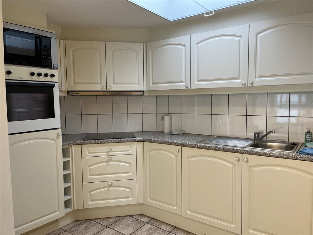 Gezellig en instapklaar triplex appartement met 2 slaapkamers in het centrum van Opoeteren foto 6