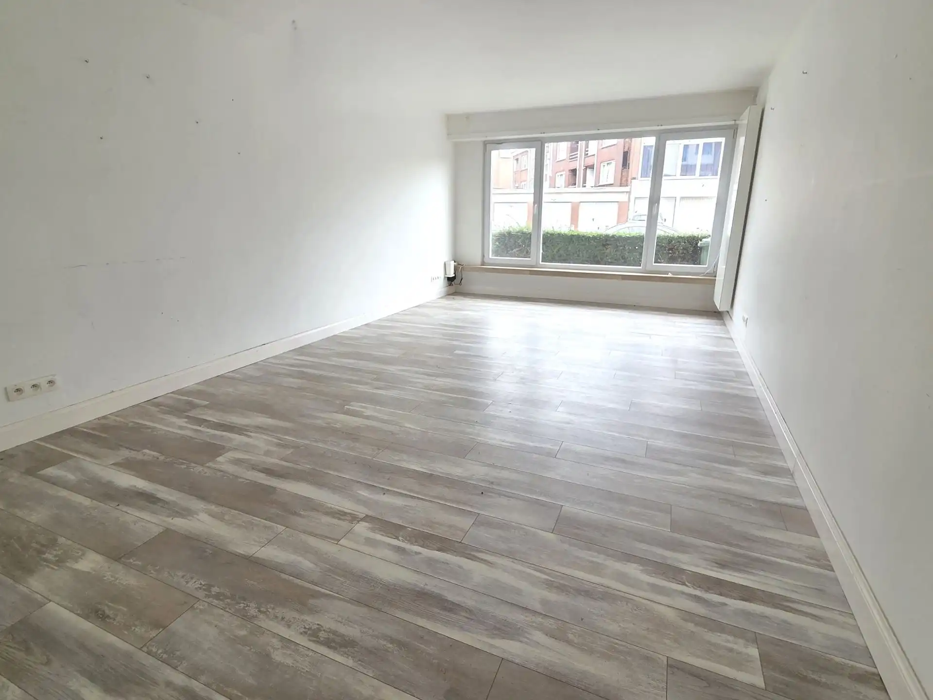Instapklaar gelijkvloers appartement met zonnige tuin foto 3